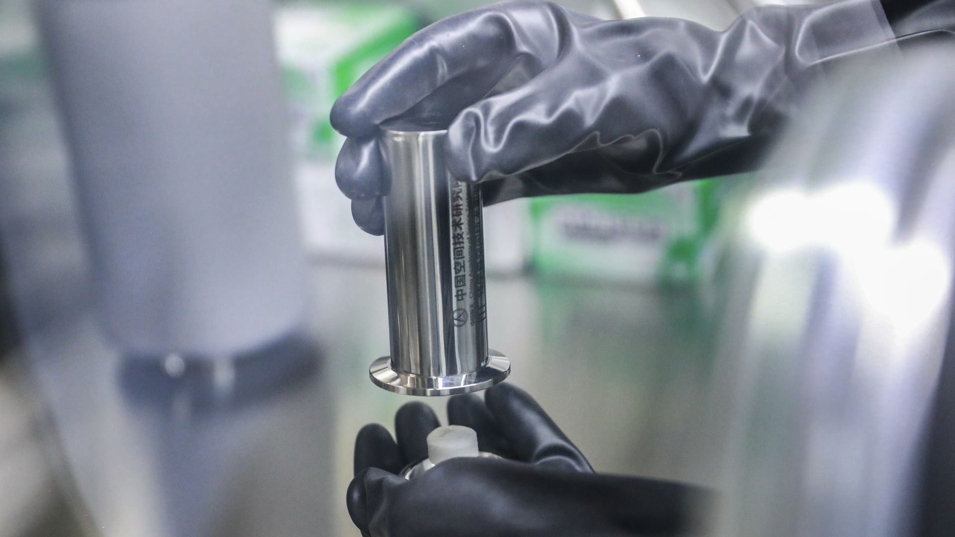 A researcher works on lunar soil brought back from the moon by China's Chang'e-5 probe 