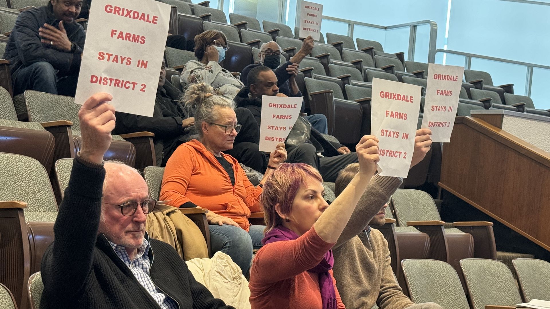  Grixdale Farms residents Tim and Ginger Quinn sit beside Asher Van Sickle, all of whom spoke yesterday at City Council urging members to stay in District 2, which is represented by Angela Whitfield Calloway. Photo: Samuel Robinson/Axios