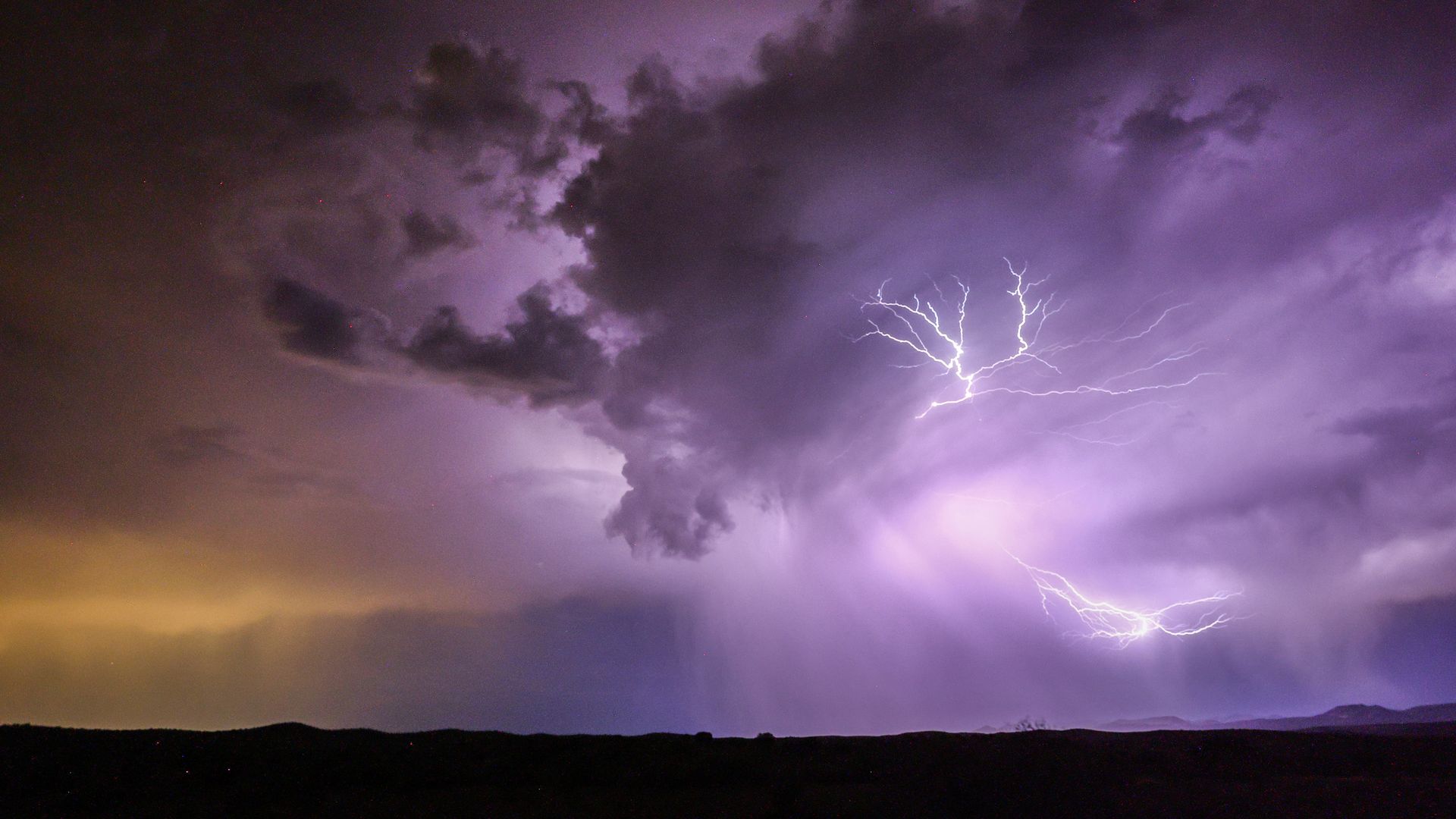A thunderstorm with lightning flashes in the Southwest, U.S. at night.