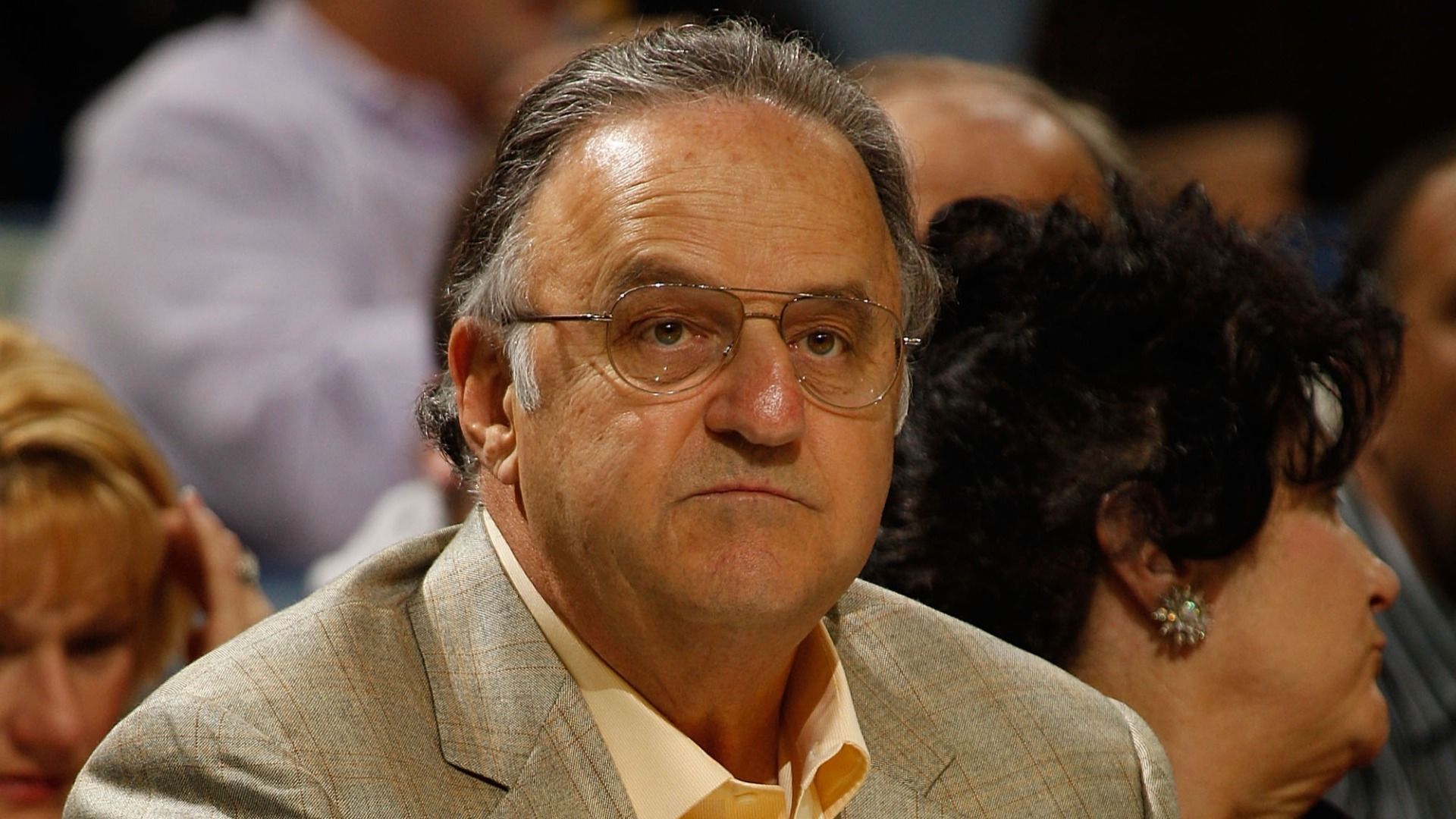 Photo shows a man in a suit.