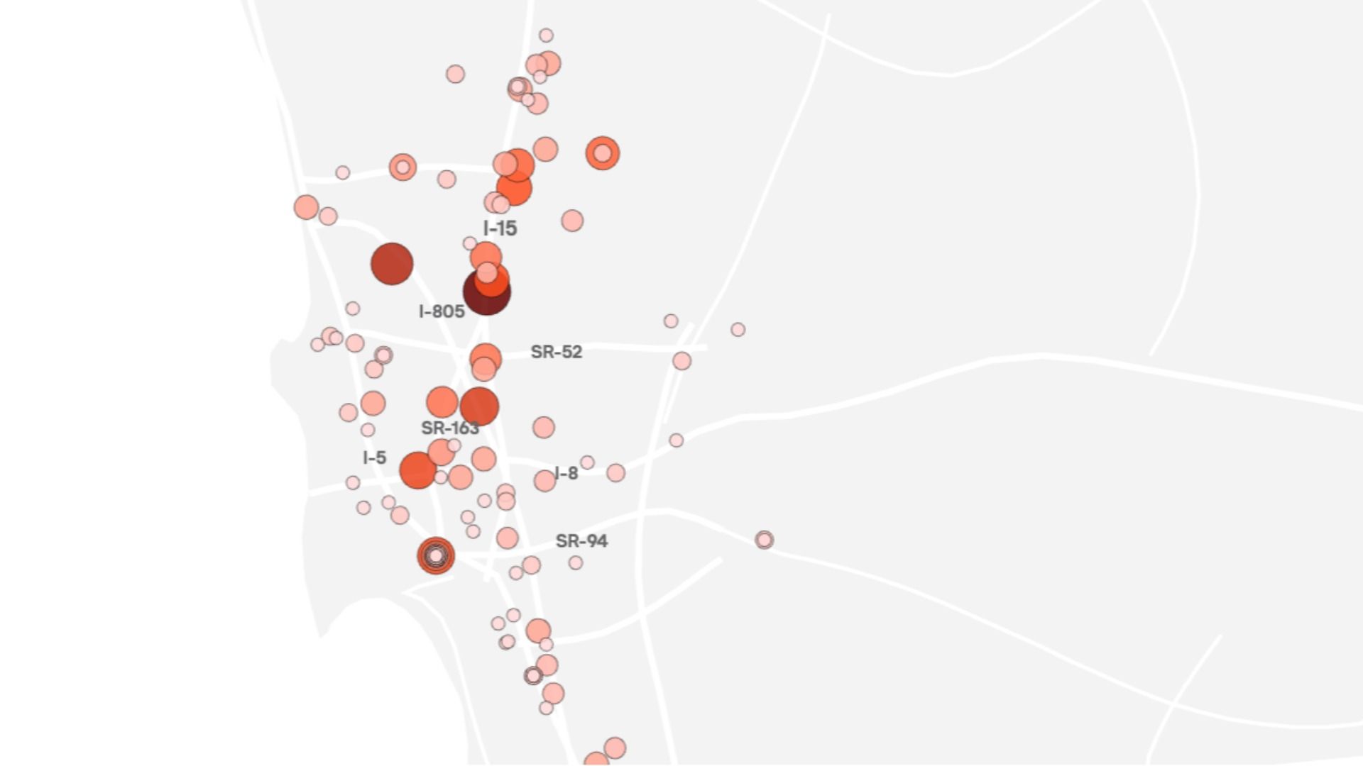 Map view with a light gray road network and pink to red circular markers, densely clustered around I-15, I-805, and SR-52; larger circles indicate higher values.