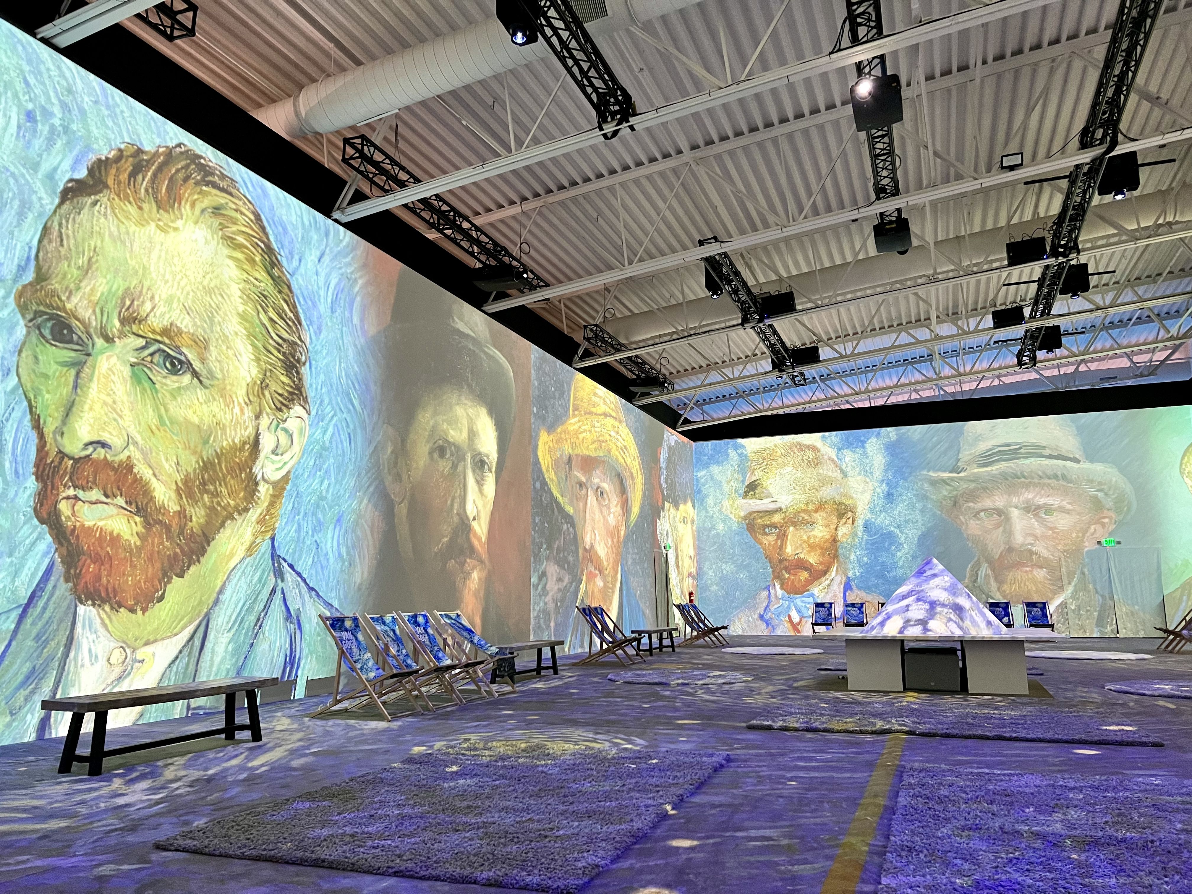 multiple photos of van gogh projected onto walls.