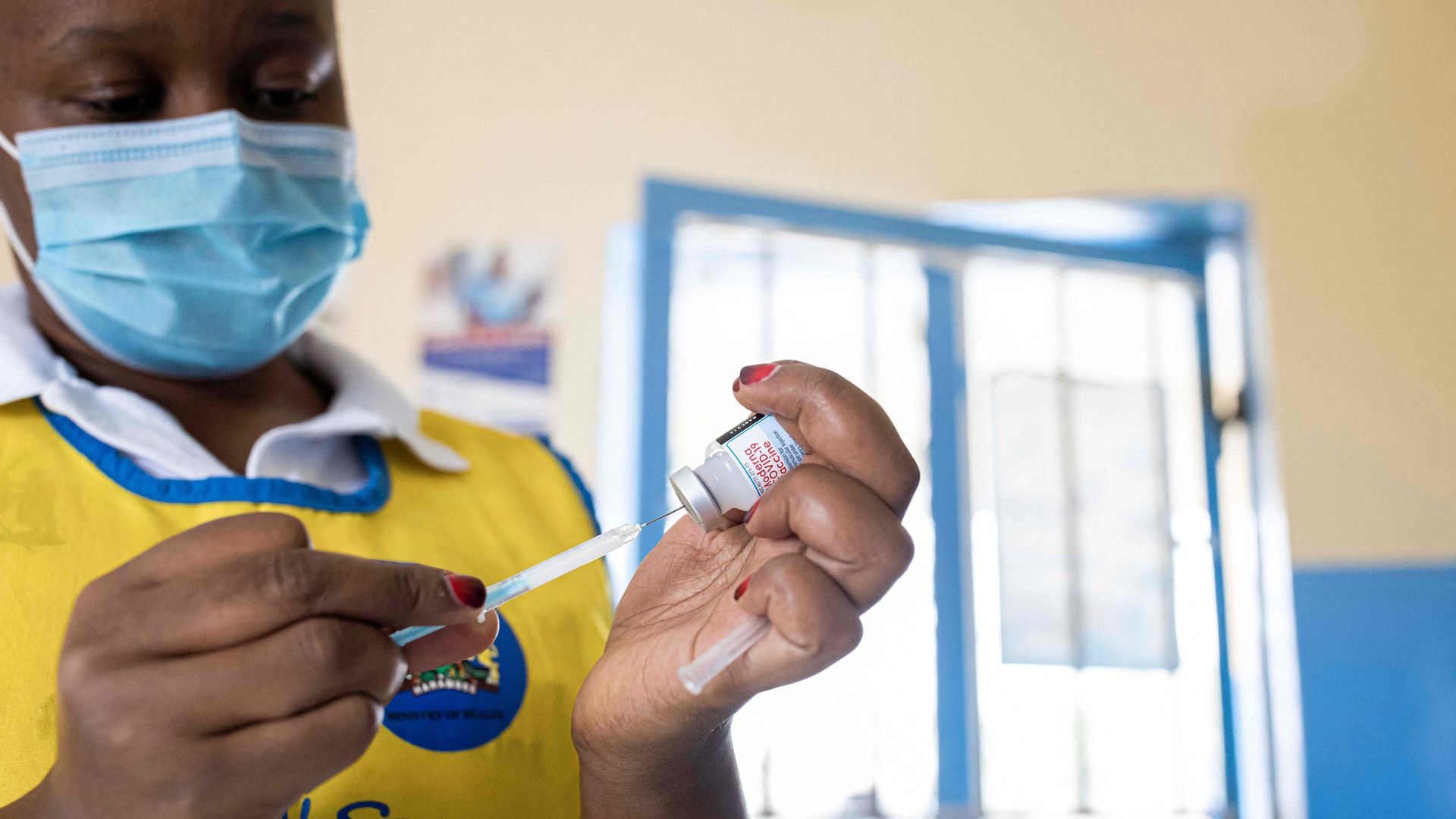 A nurse prepares a dose of Moderna Covid-19 vaccine at Oltepesi Dispensary in Kajiado, Kenya.