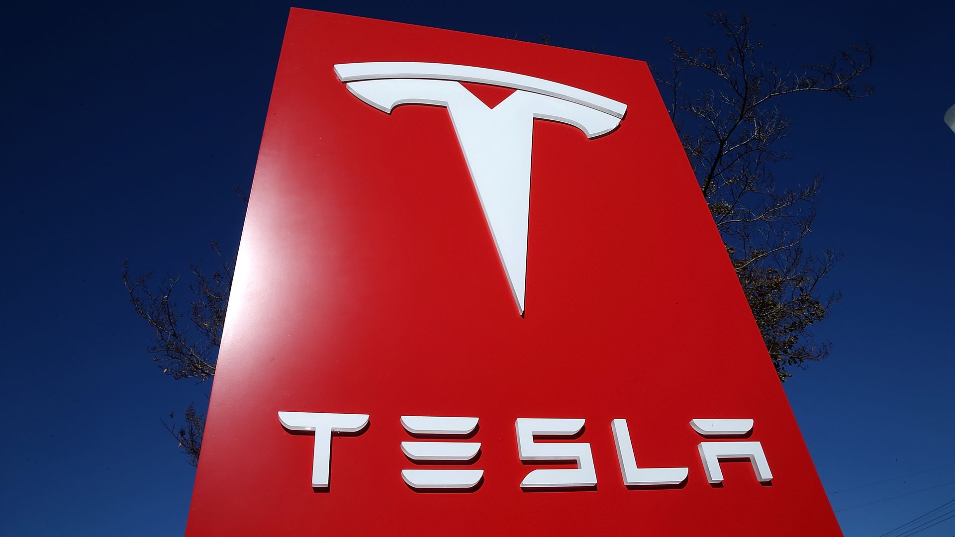 A sign is posted at a Tesla showroom on November 5, 2013 in Palo Alto, California