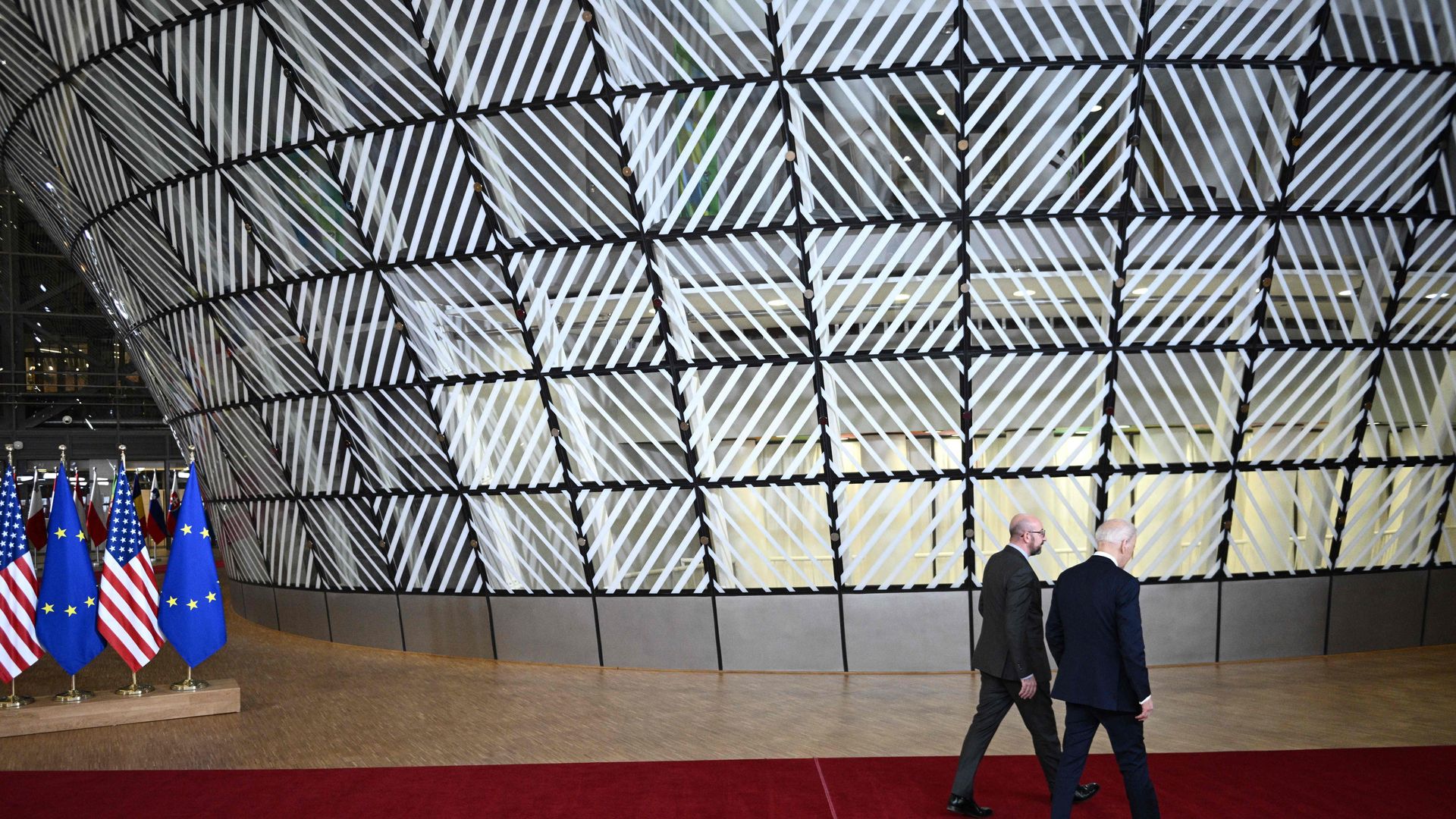 President Biden is seen walking with European Council President Charles Michel.