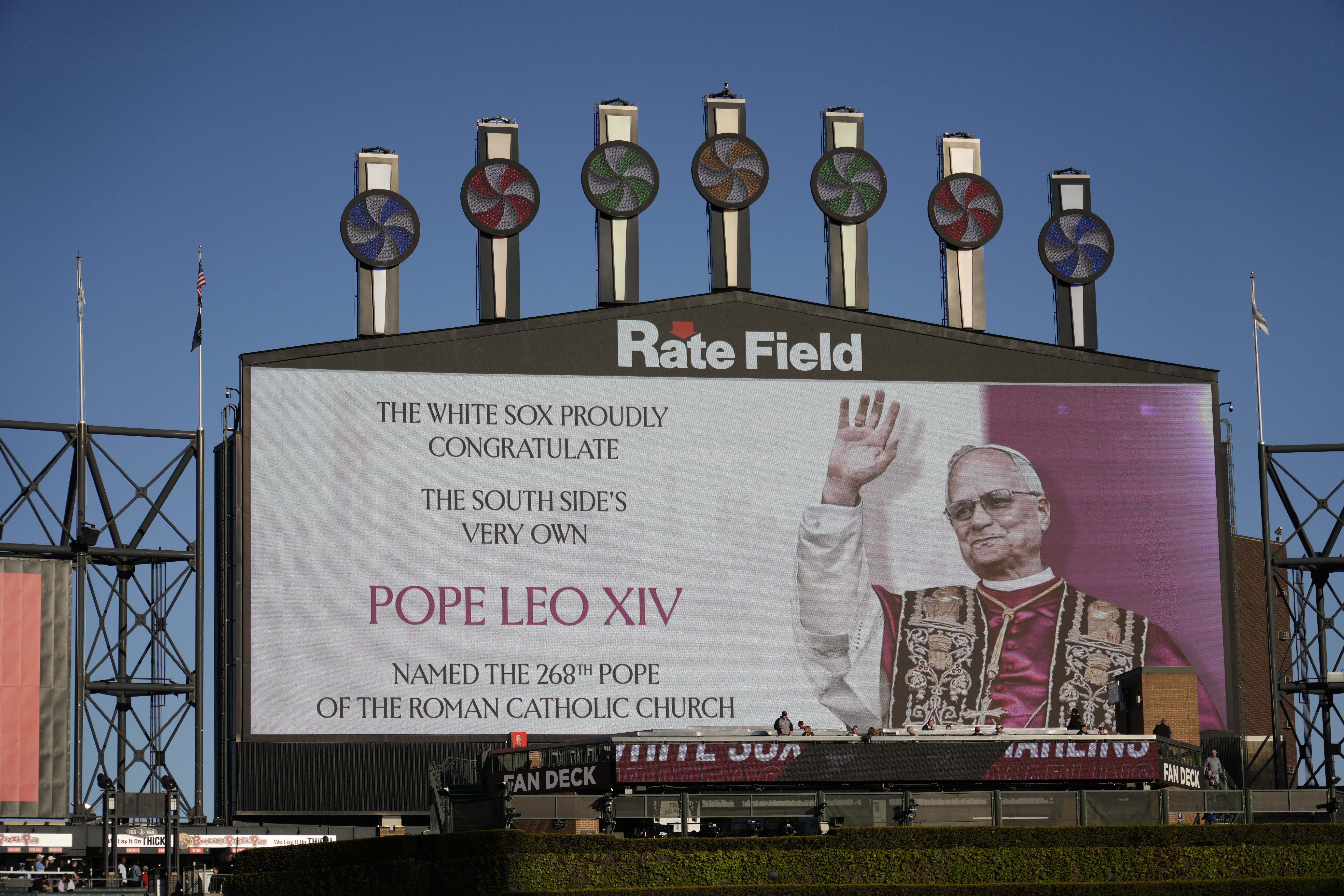 Photo of pope projected over field