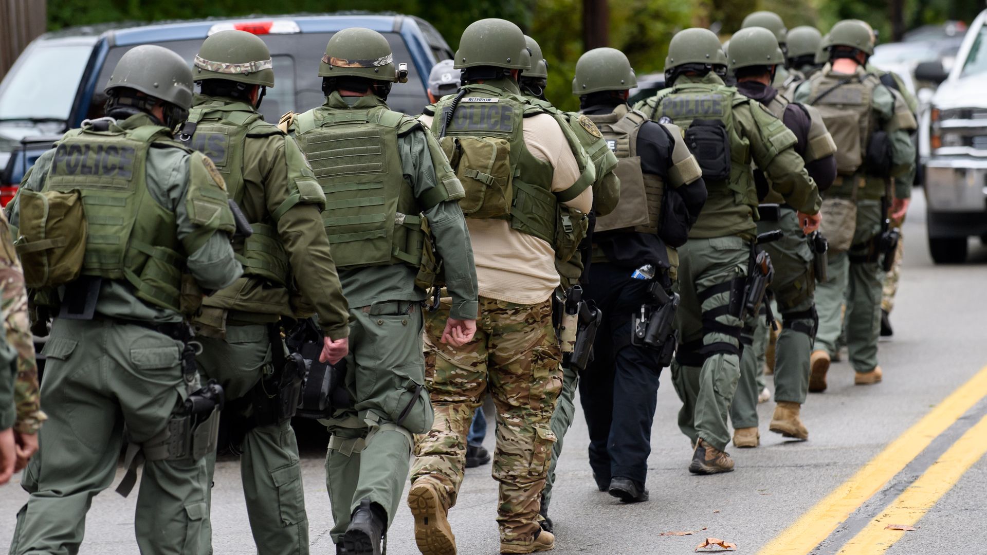 Officers head toward the scene of the crime.