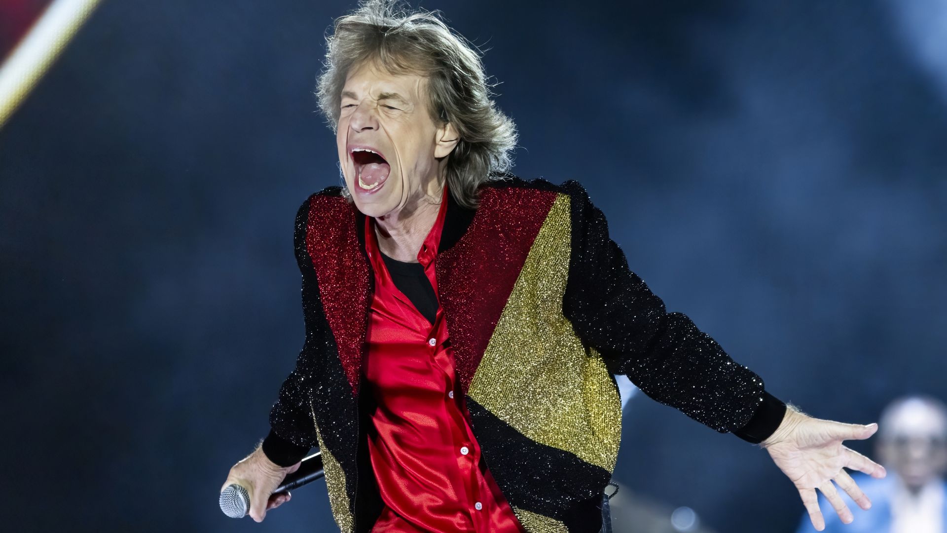 Mick Jagger shouts on stage. 