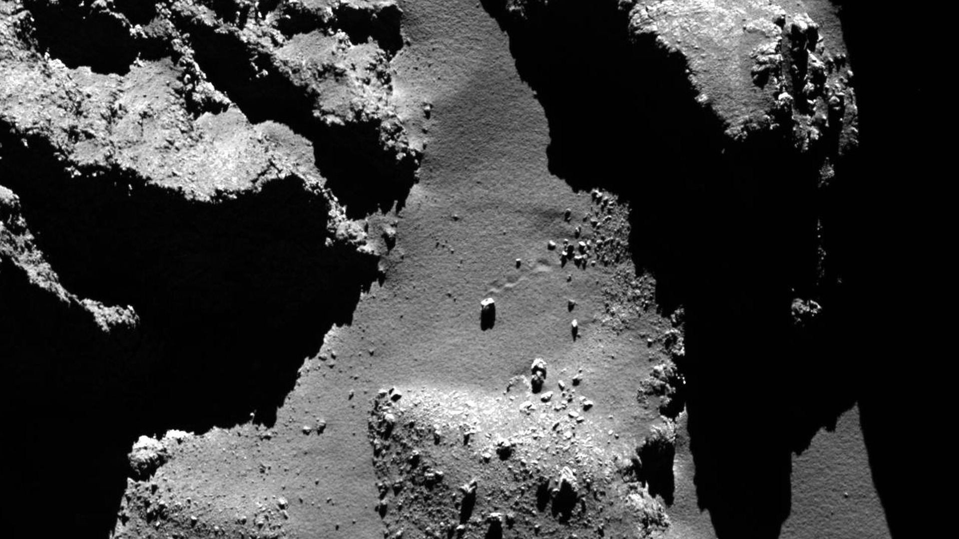 A boulder on the surface of a comet.