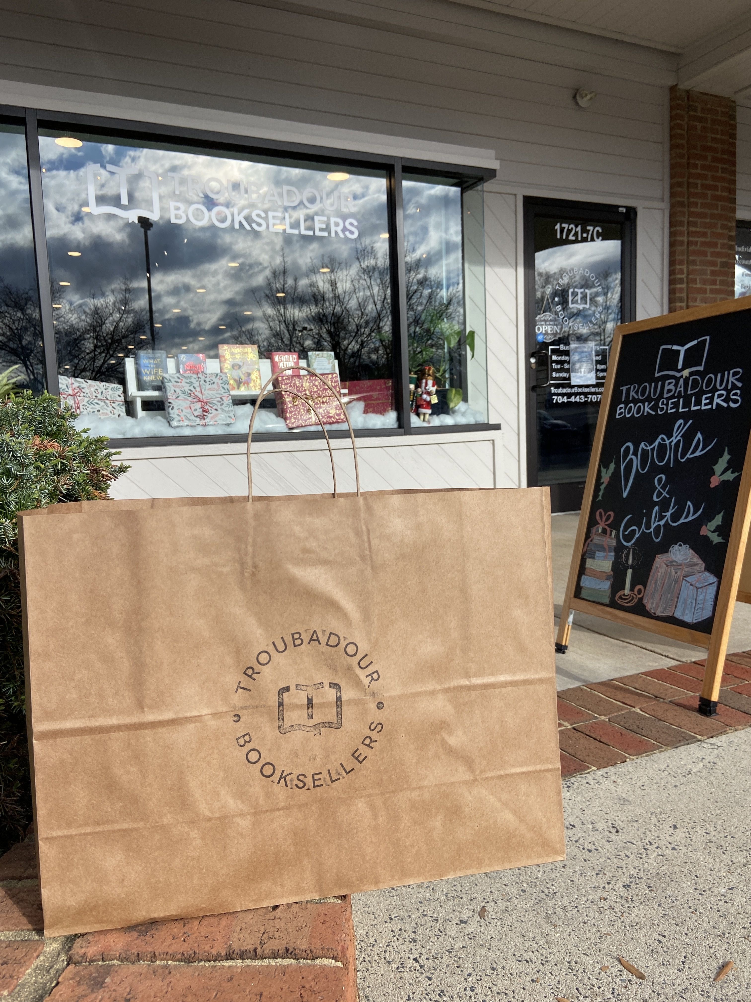 A bag in front of a bookstore. 