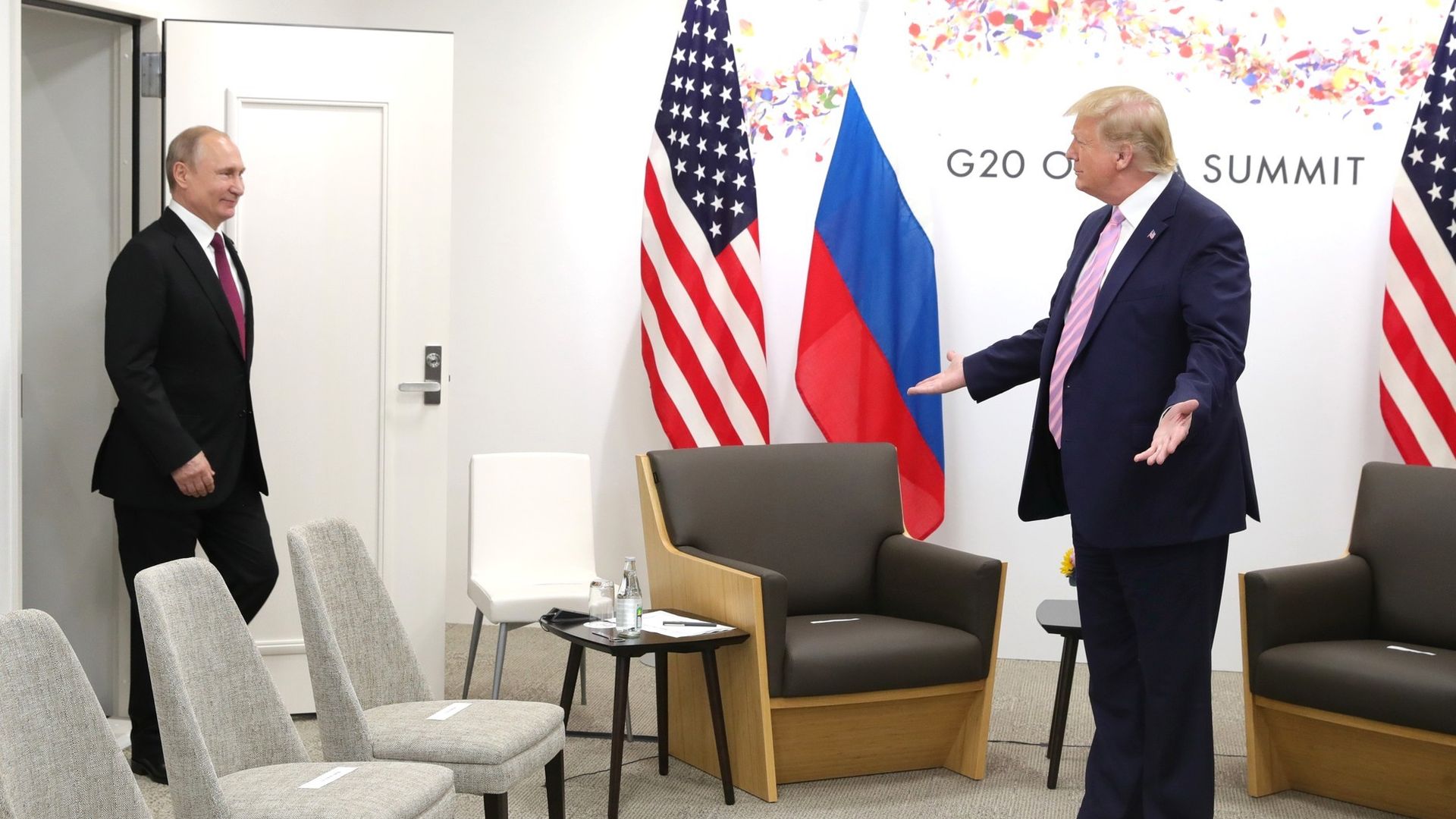 Trump shrugging at Putin