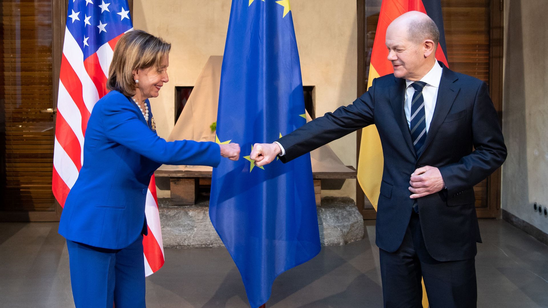 House Speaker Nancy Pelosi is seen fist-bumping with German Chancellor Olaf Scholz.