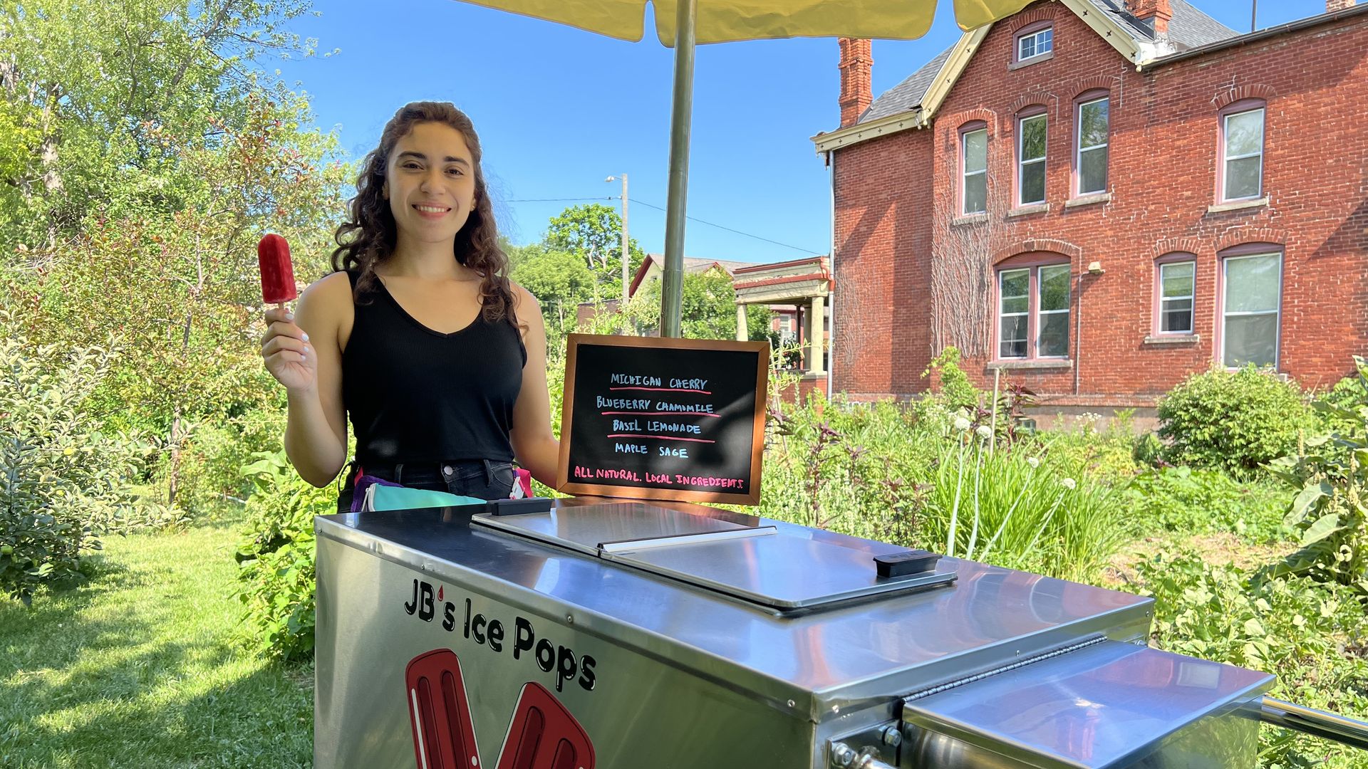 Jena Brooker of JB's Ice Pop behind her popsicle cart in Detroit's Woodbridge neighborhood.