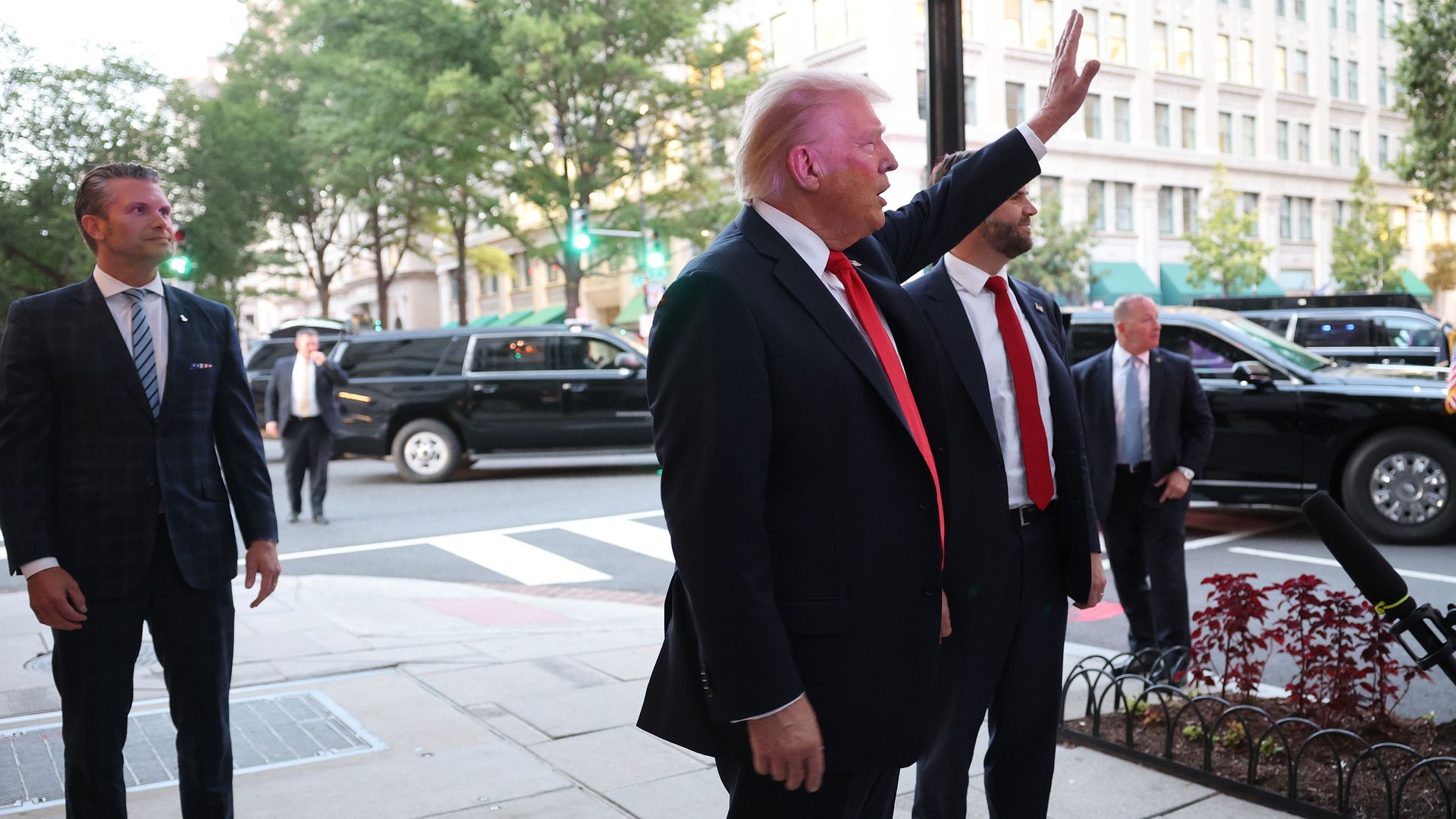President Trump waves to the crowd as he arrives for dinner at Joe's Seafood, Prime Steak & Stone Crab on Sept. 9 in Washington, D.C.