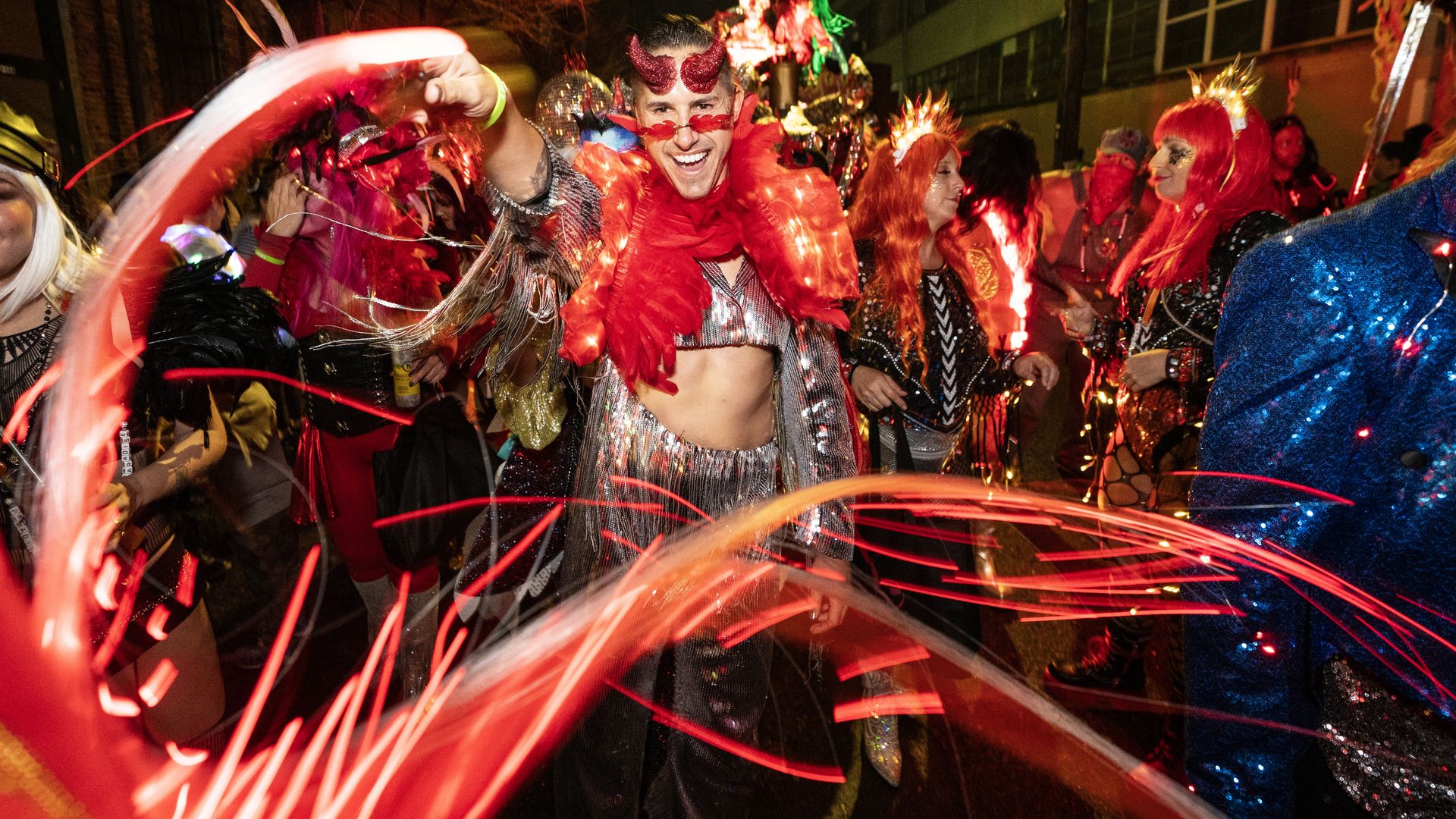 Photo shows someone with a light whip and devil horns