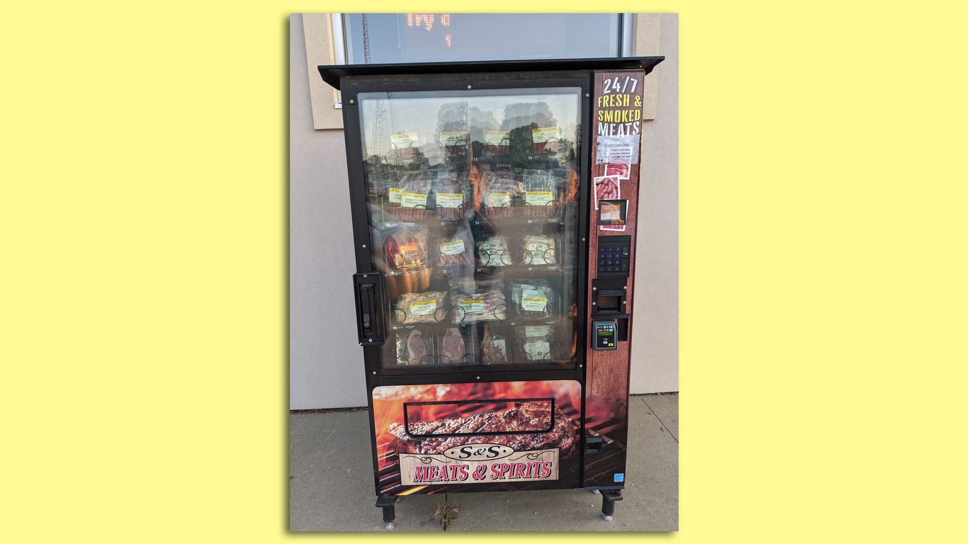 An outdoor vending machine that dispenses meat.