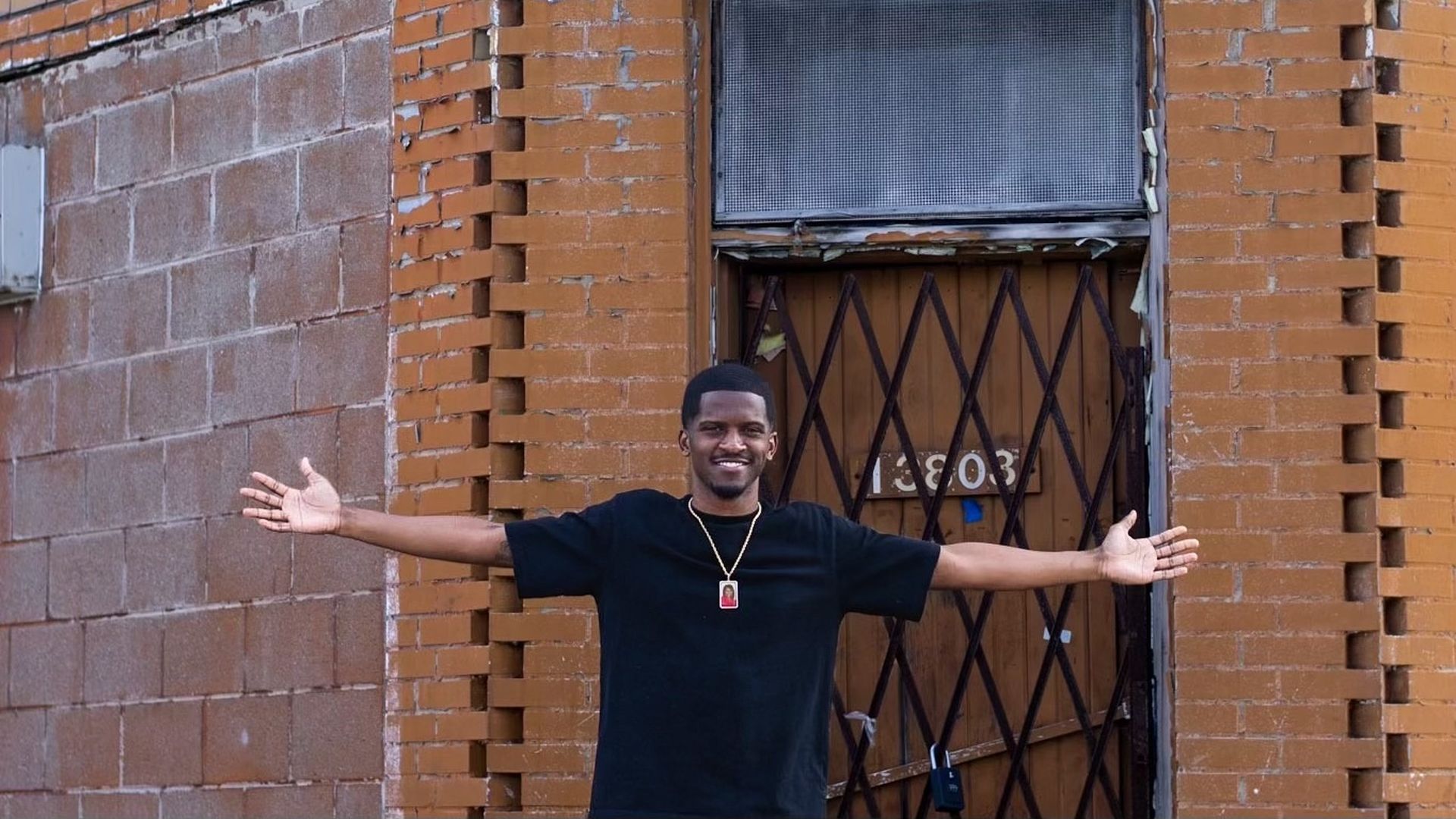 Jerjuan Howard in front of 13803 Puritan St.