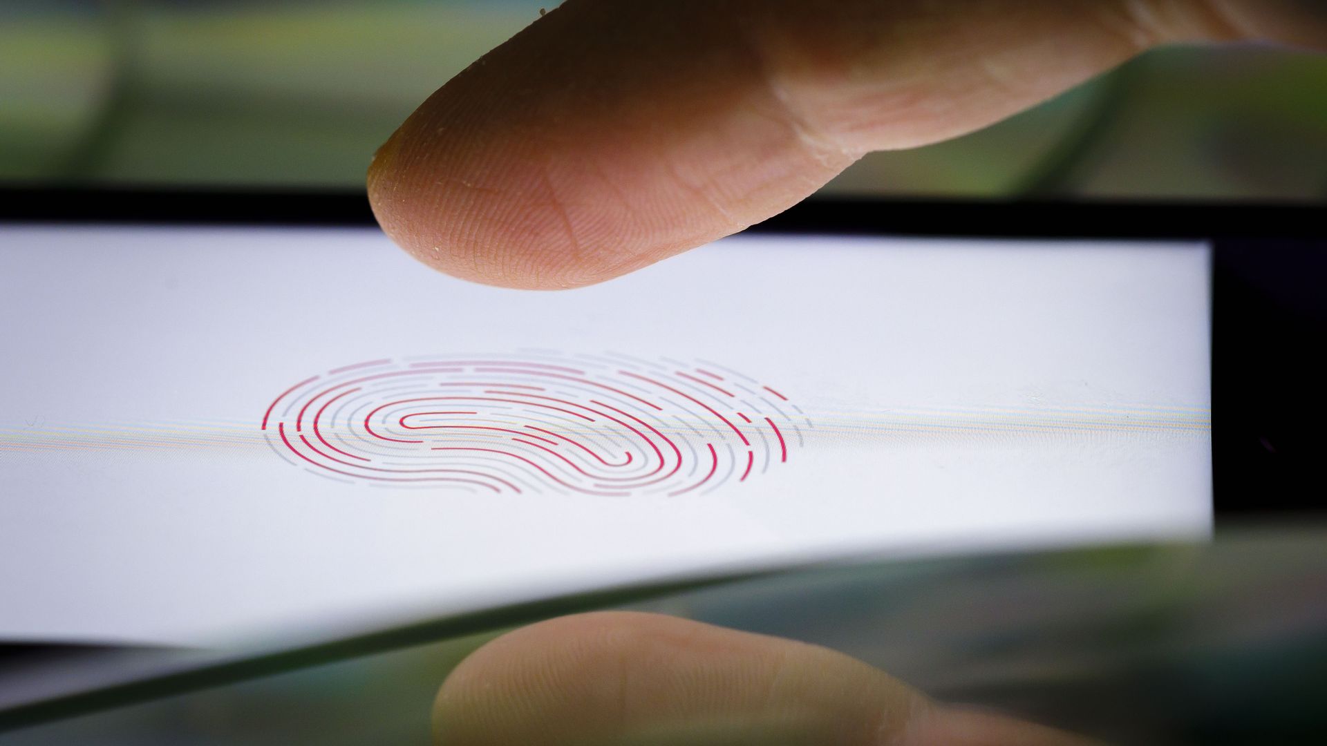 A person using a fingerprint to log in.
