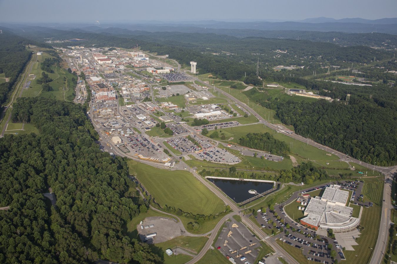Aerial view of a security complex with small buildings and greenery