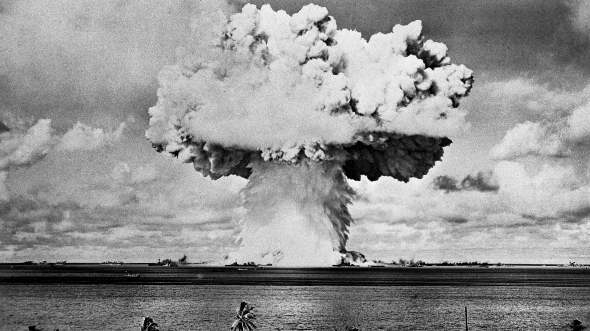 An automatic camera on a nearby island recorded this phase of the atomic bomb explosion on "Baker Day," July 25th, in Bikini Lagoon.