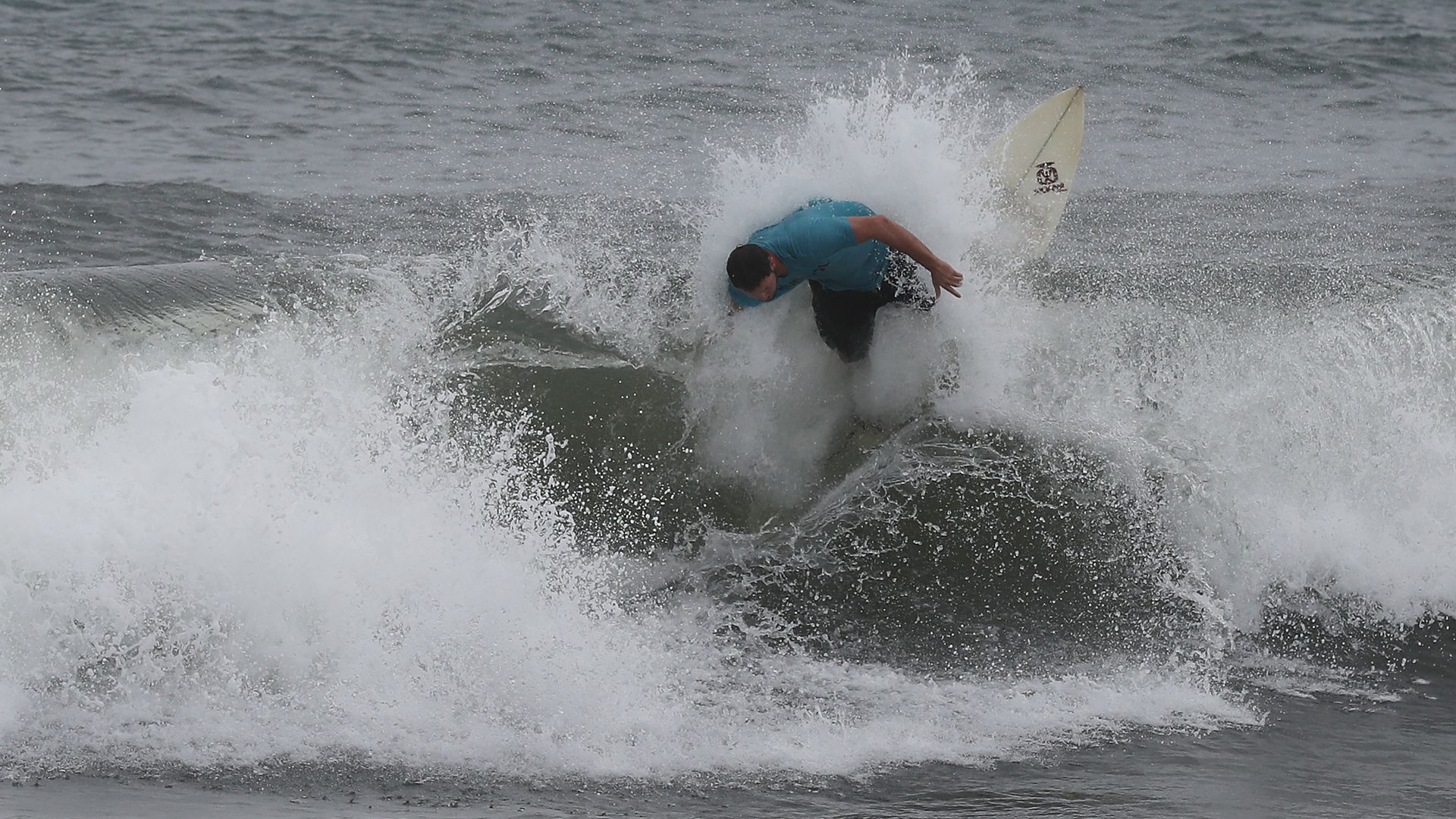 A surfer wipes out in the rough waves off the coast of Florida as Hurricane Dorian approaches