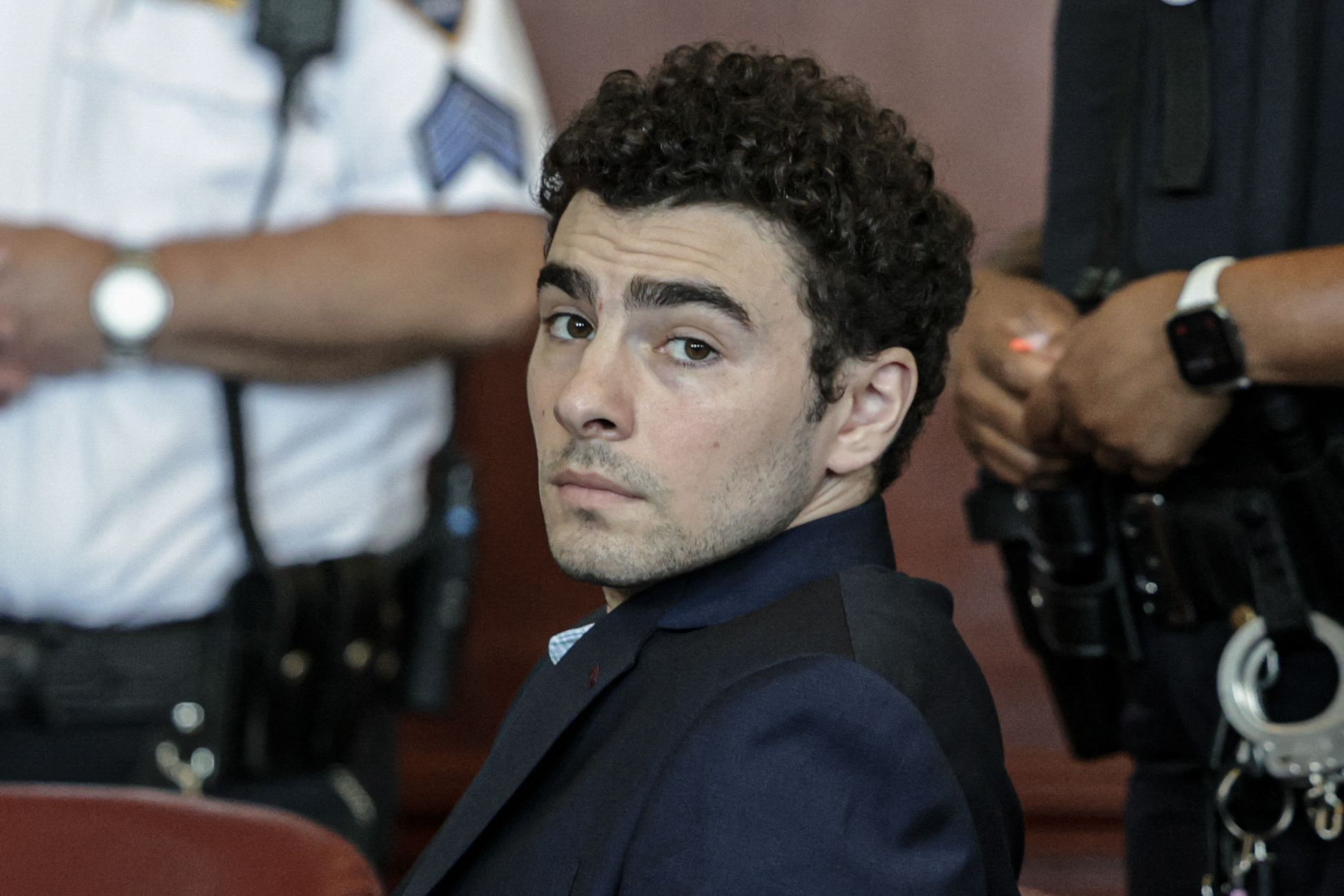 axios.com - Donica Phifer - Luigi Mangione pleads guilty to stalking UnitedHealthcare CEO