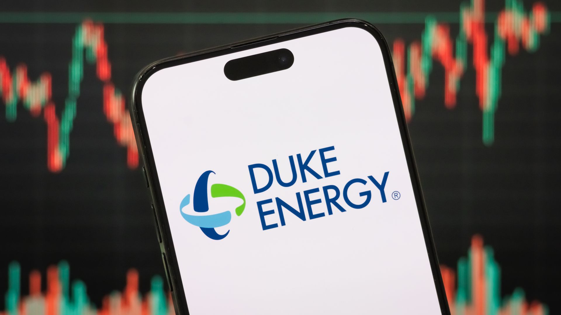  In this photo illustration, the logo of Duke Energy Corporation is displayed on a smartphone screen, with the company's stock market chart in the background, on May 4, 2025, in Chongqing, China. Duke Energy is a major American electric power holding company based in North 