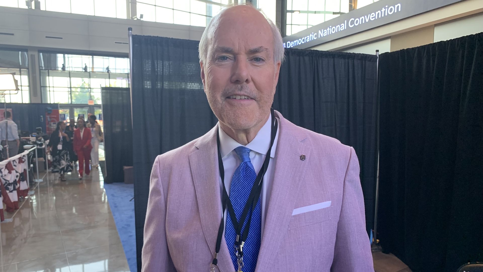 Photo of a man with a pink suit 