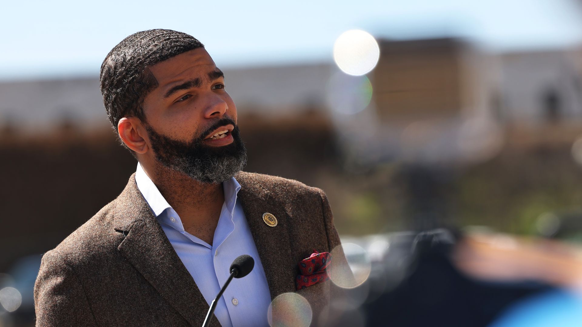 Photo of Chokwe Antar Lumumba speaking from a podium