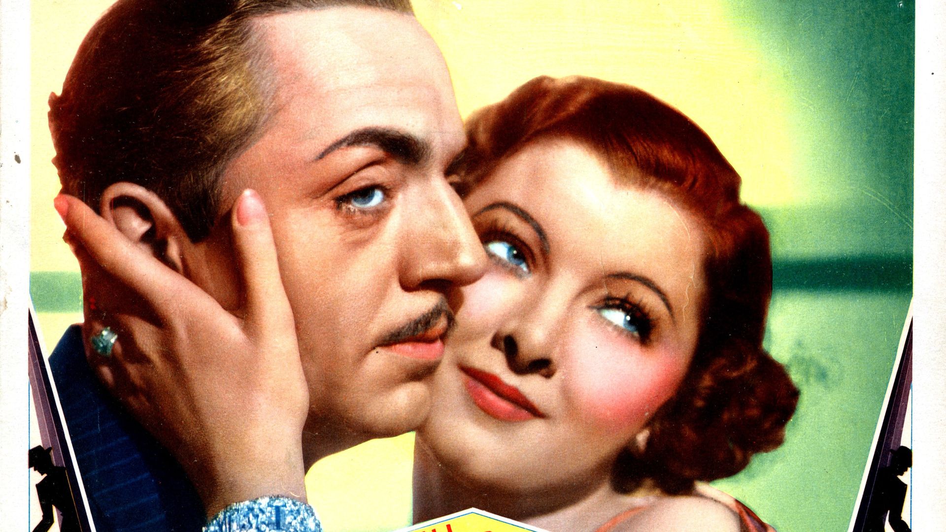 Close-up of a man with a mustache and a woman with red hair embracing; text below reads "William Powell and Myrna Loy in The Thin Man" in a vintage style.