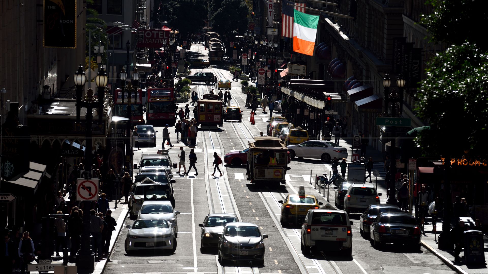 a street with mixed traffic in downtown San Francisco