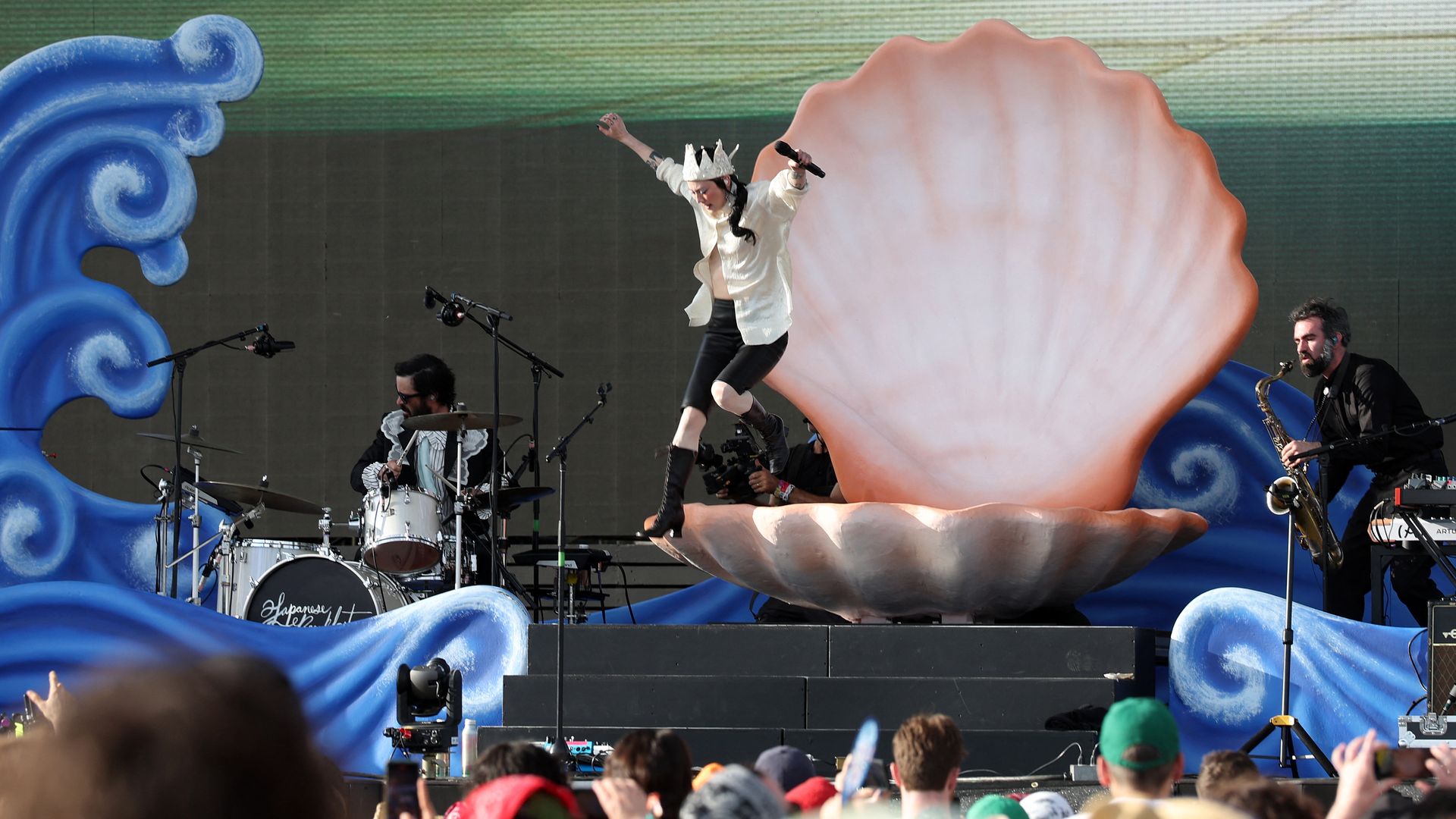 Japanese Breakfast jumping from a clam shell on stage at Coachella