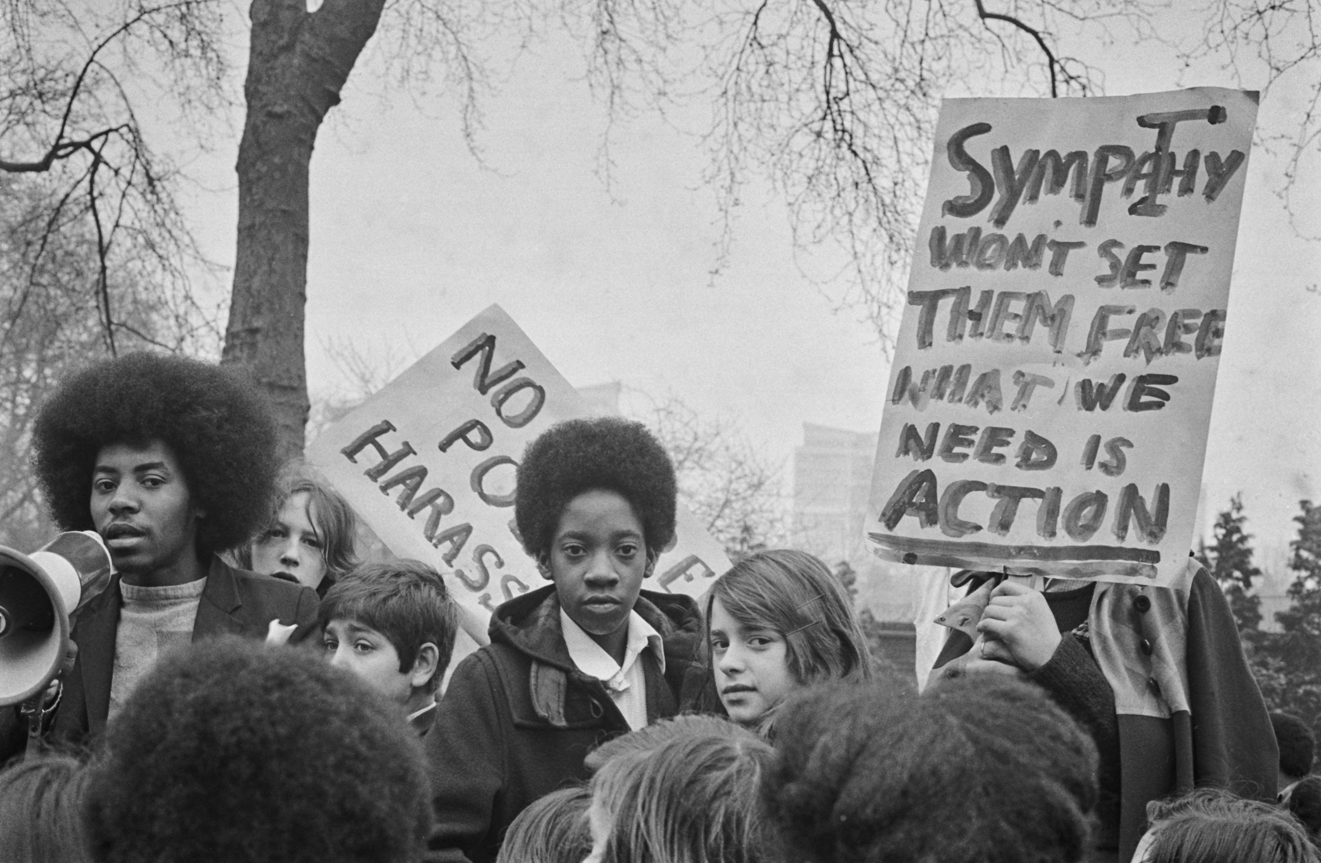 Schoolchildren with placards reading 'No More Police Harassment' during a school strike in London, UK, 3rd April 1974. They are demanding the release of the Brockwell Three, three young Black men who were arrested during a disturbance in Brockwell Park, South London, and sentenced to three years in prison. 