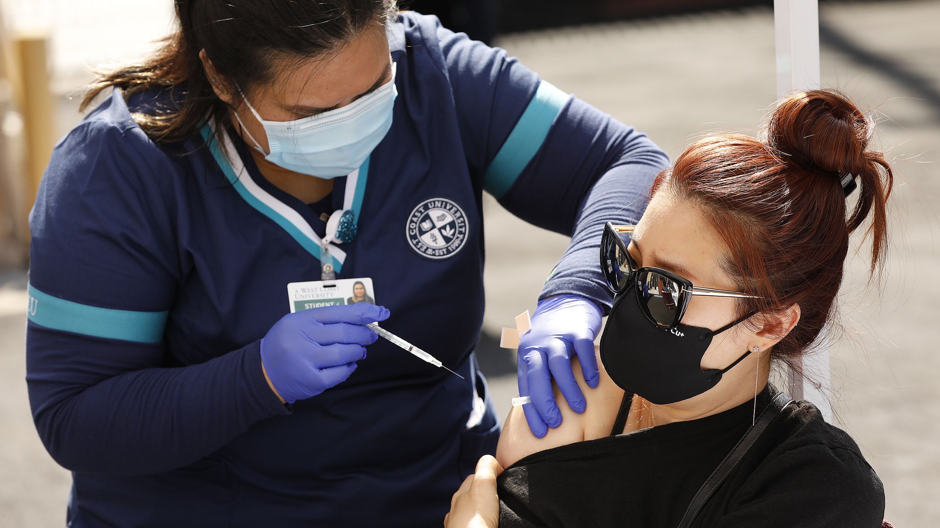 A woman receiving the Pfizer COVID-19 vaccine