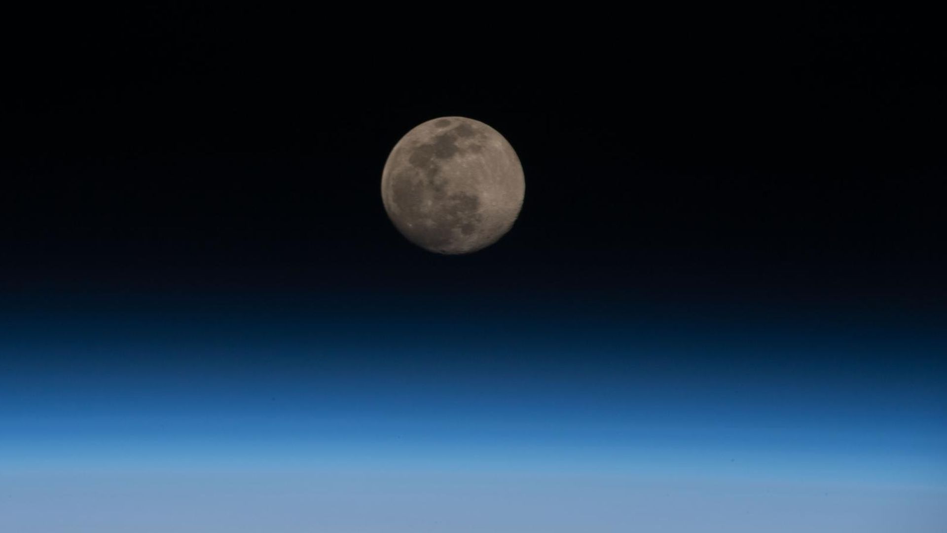 The Moon seen just above the Earth's atmosphere.