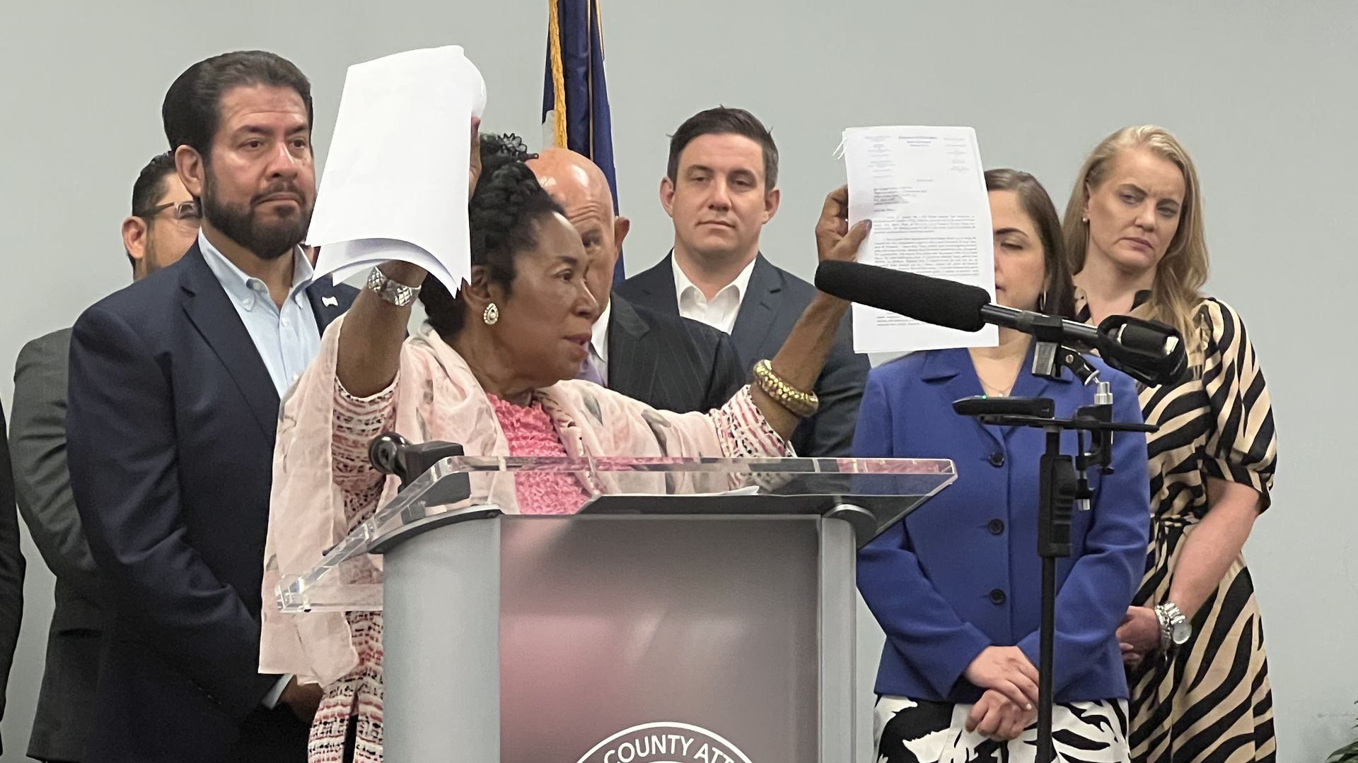 Democrat Congresswoman Sheila Jackson Lee holds up papers during a press conference announcing an EPA investigation.