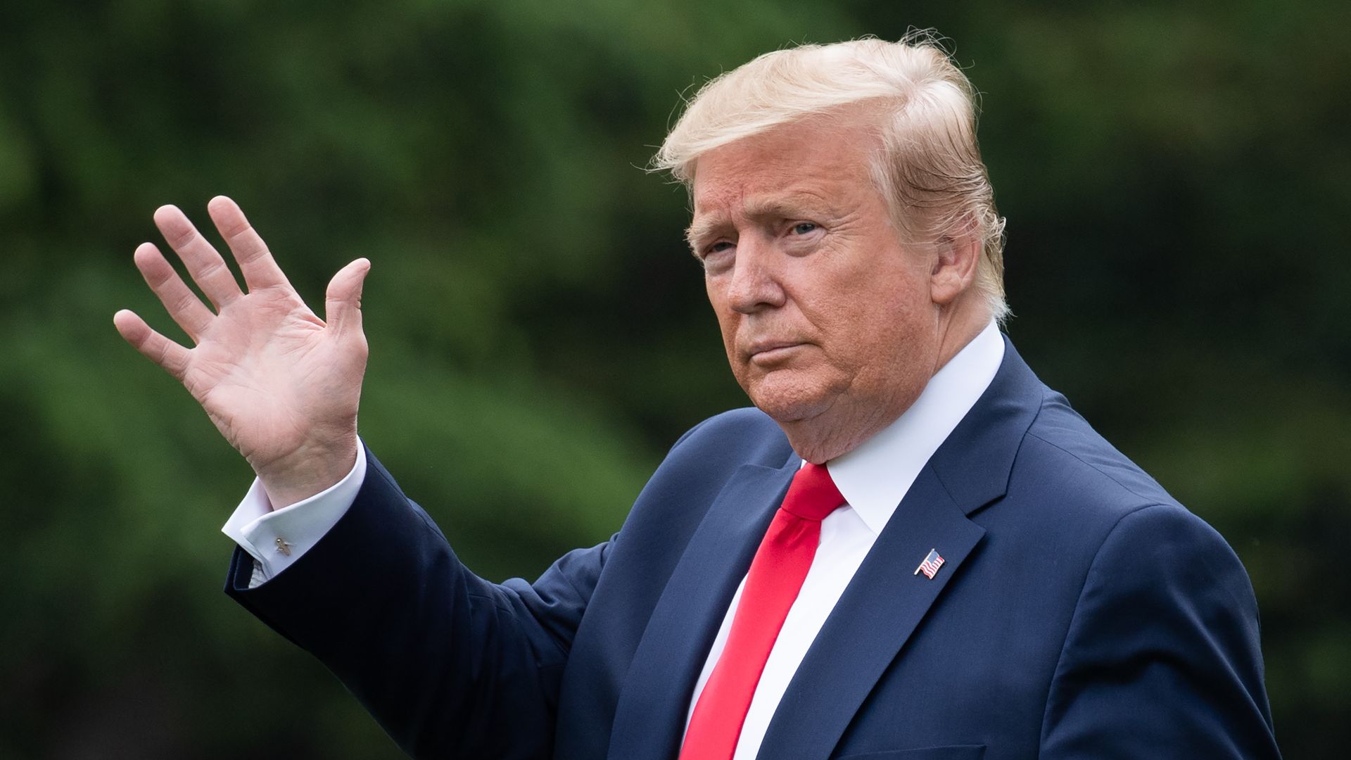 Trump waves
