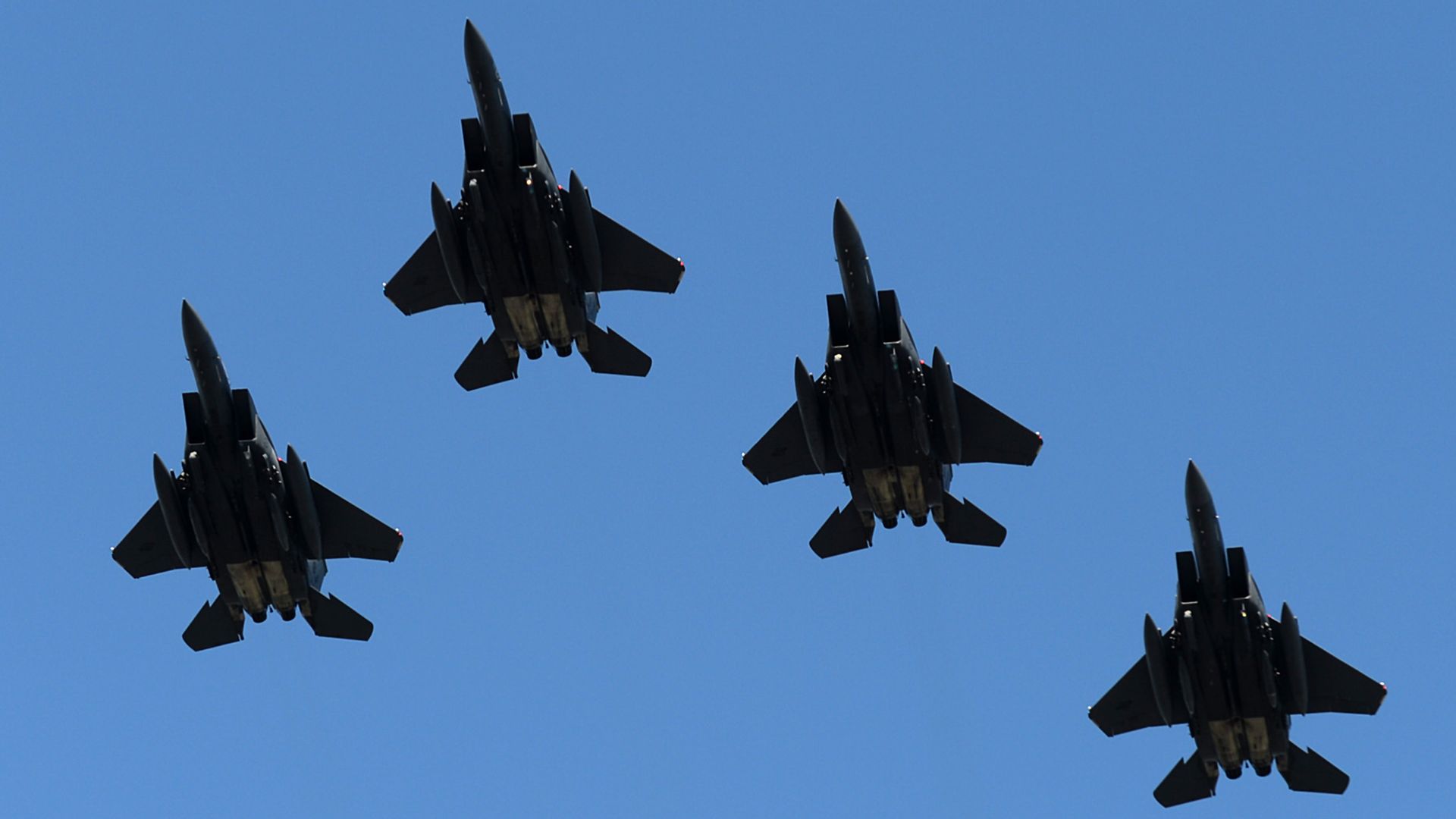 Four F-15's from Seymour Johnson AFB fly over Charlotte Motor Speedway during the national anthem on Sunday, May 28, 2017. (Jeff Siner/Charlotte Observer/Tribune News Service via Getty Images)