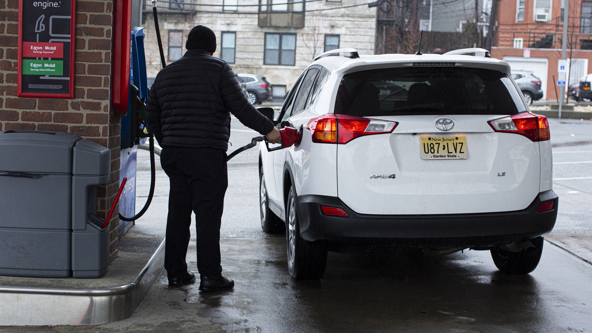 An attendant pumping gas in New Jersey