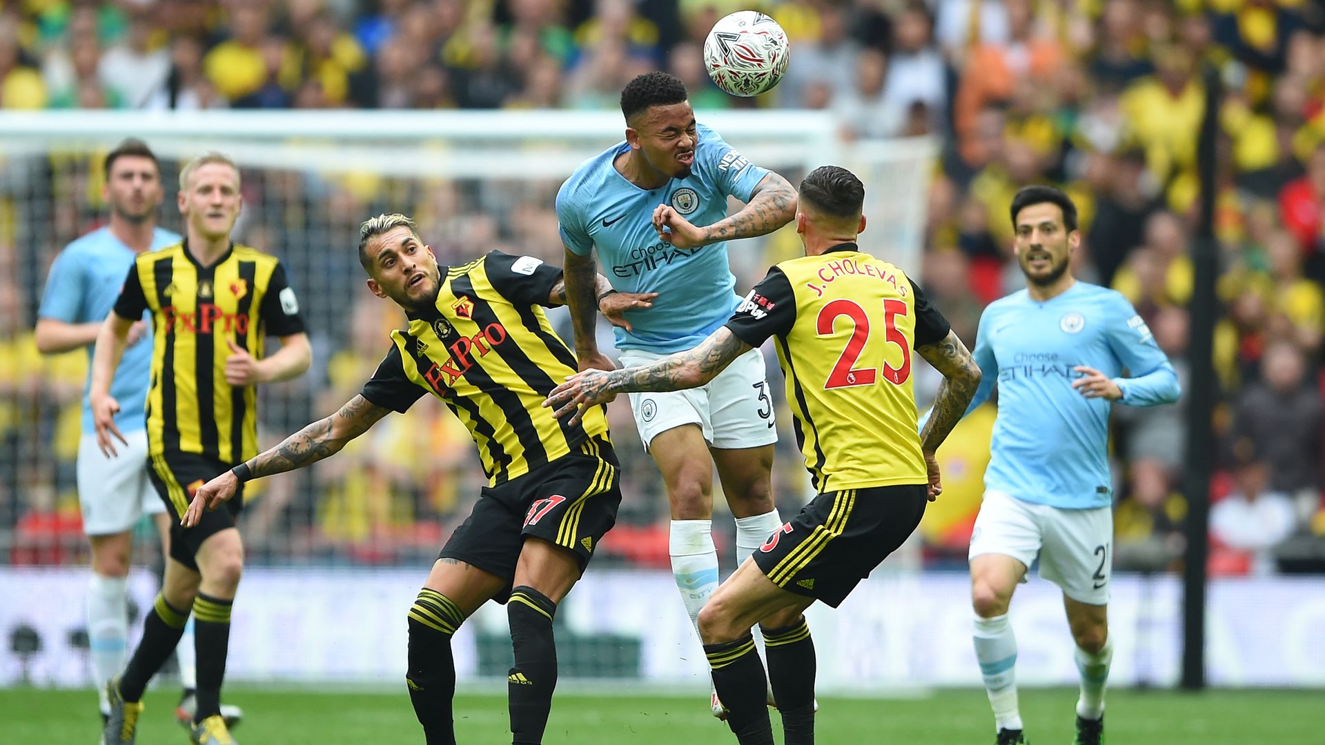 A Manchester City player heading a ball