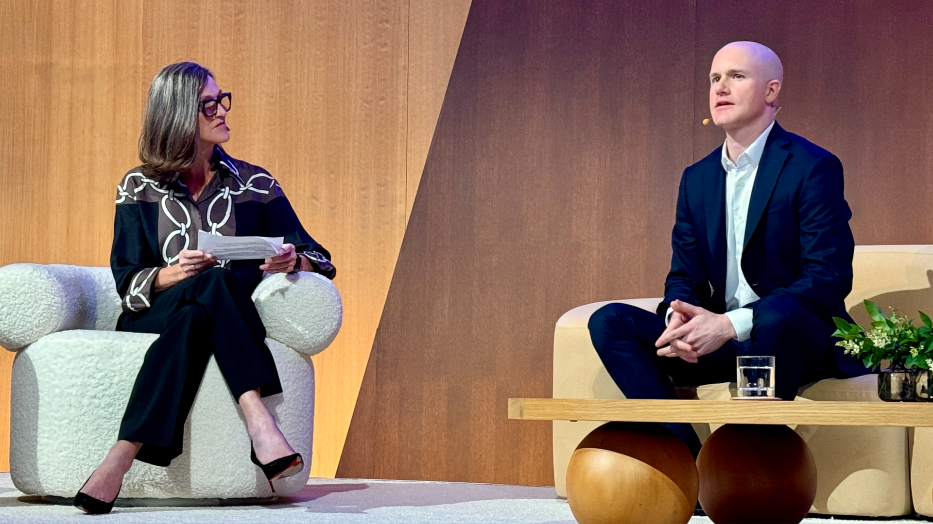 Ark Invest's Cathie Wood on-stage with Coinbase Global chief Brian Armstrong.