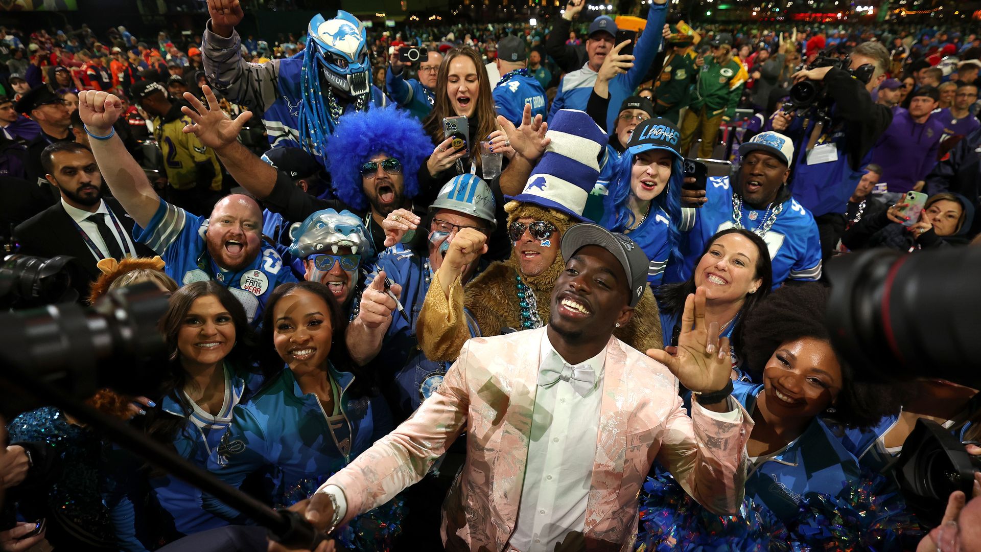 Terrion Arnold celebrates with Lions fans. 