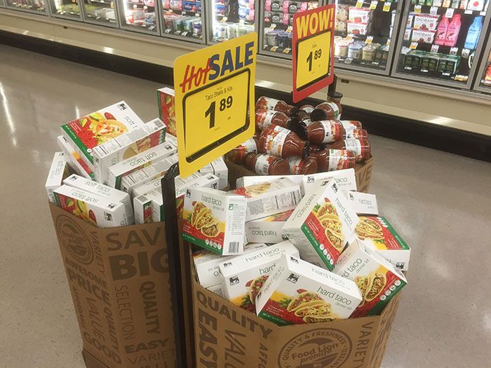 Aisles are filled with food that are grouped together to make shopping for a meal easier.