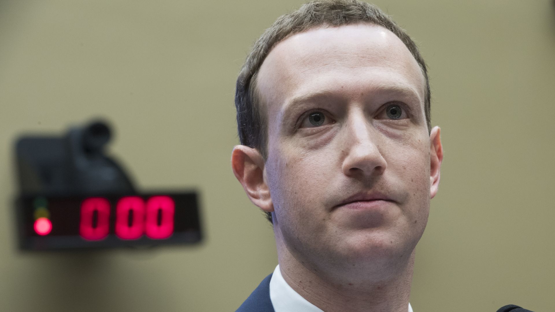 A closeup of a frowning Mark Zuckerberg