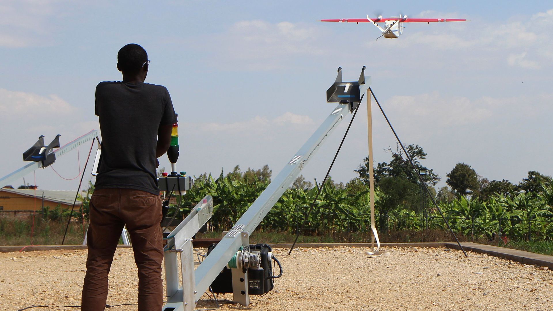 A Zipline technician launches a drone on October 12, 2016 in Rwanda.
