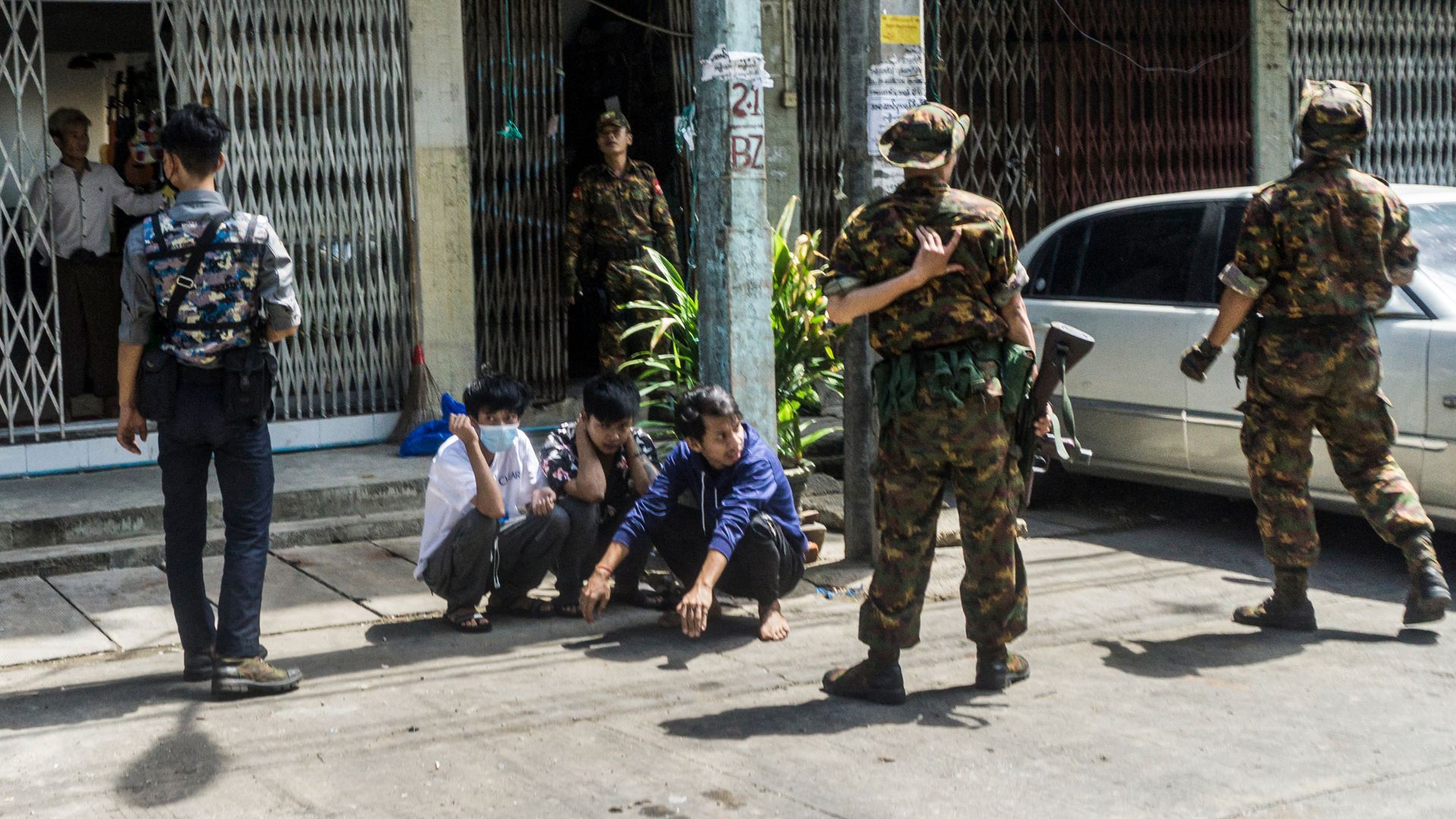 Myanmar security forces detaining protesters in Yangon in May 2021.