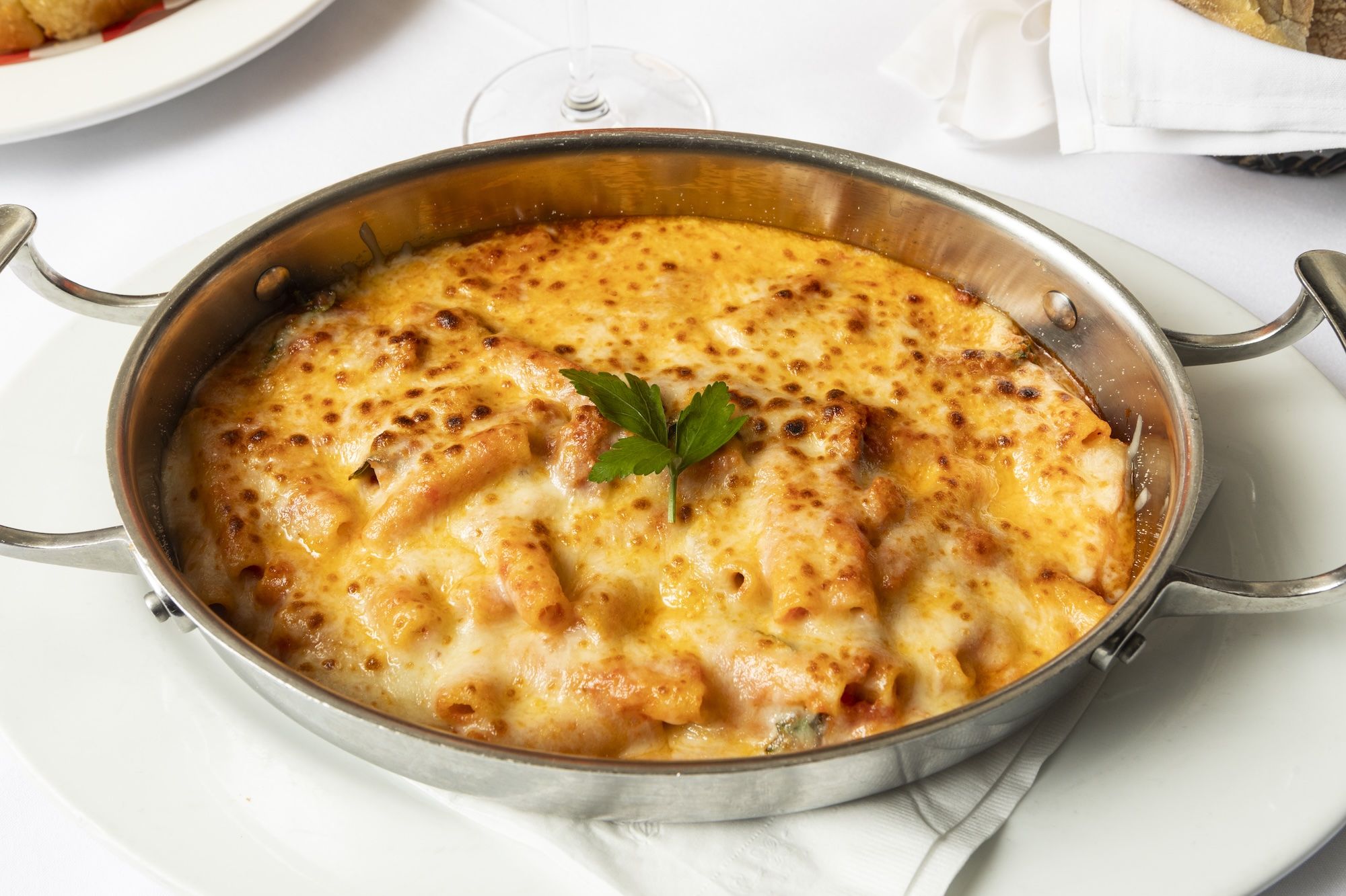 Silver pan of baked ziti.