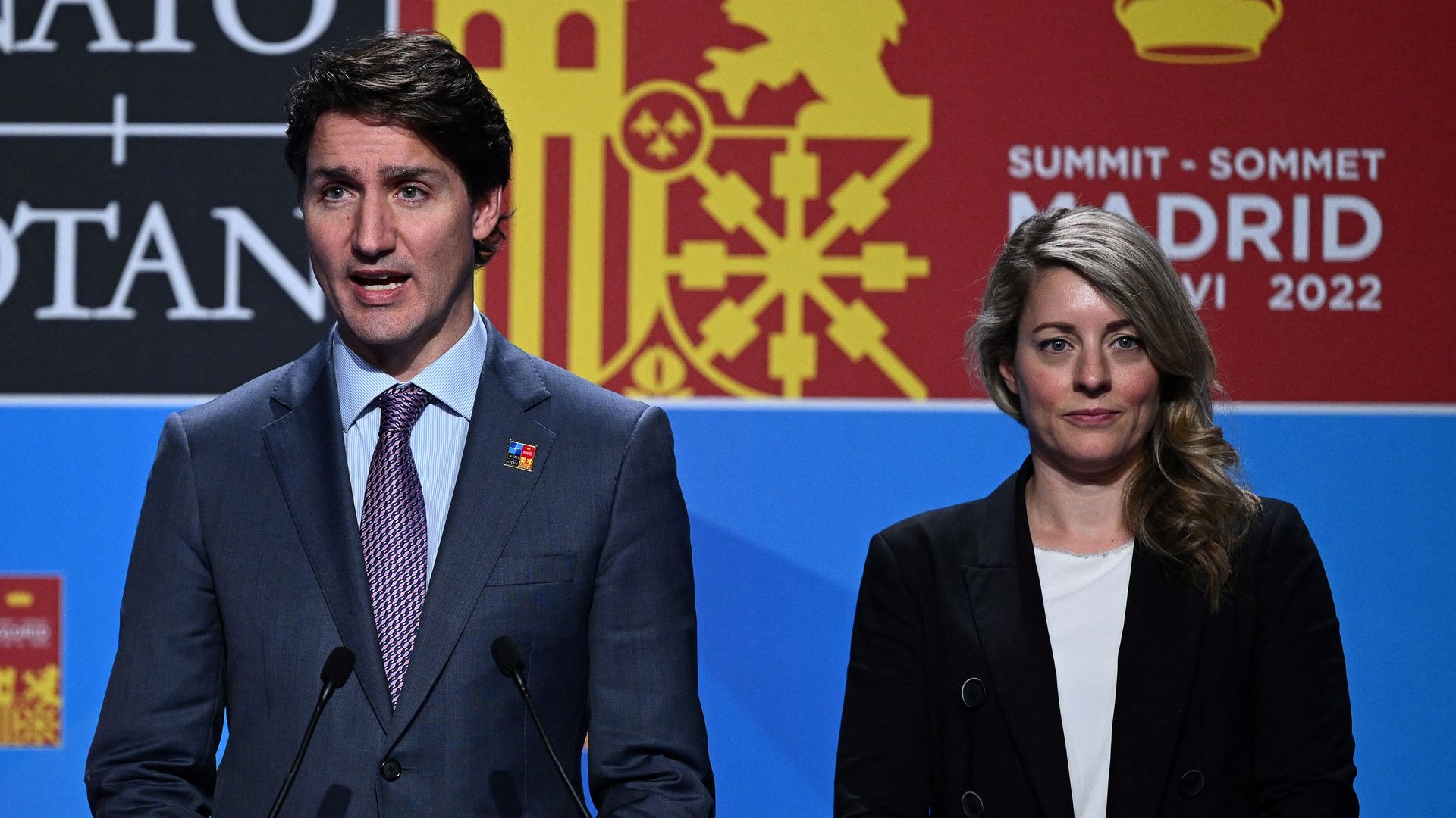 Canada's Prime Minister Justin Trudeau (C), Canada's Minister of Defence Anita Anand (L) and Canadian Minister for Foreign Affairs Melanie Joly address media representatives during a press conference at the NATO summit at the Ifema congress centre in Madrid, on June 30, 2022.
