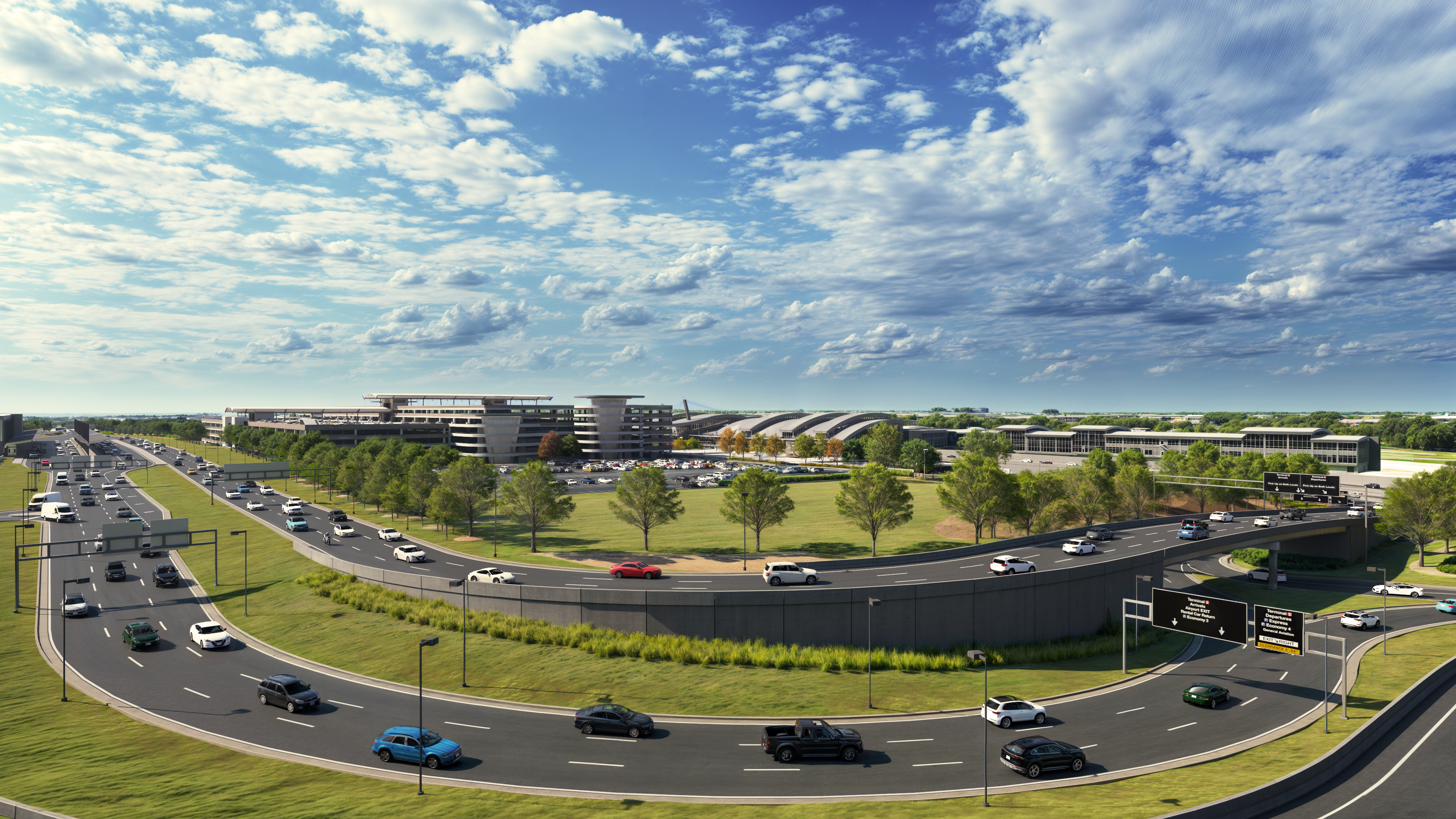 Busy multi-lane highway interchange with cars on curved ramps surrounded by green grass and trees under a partly cloudy blue sky, with large modern buildings and parking lots in the background.