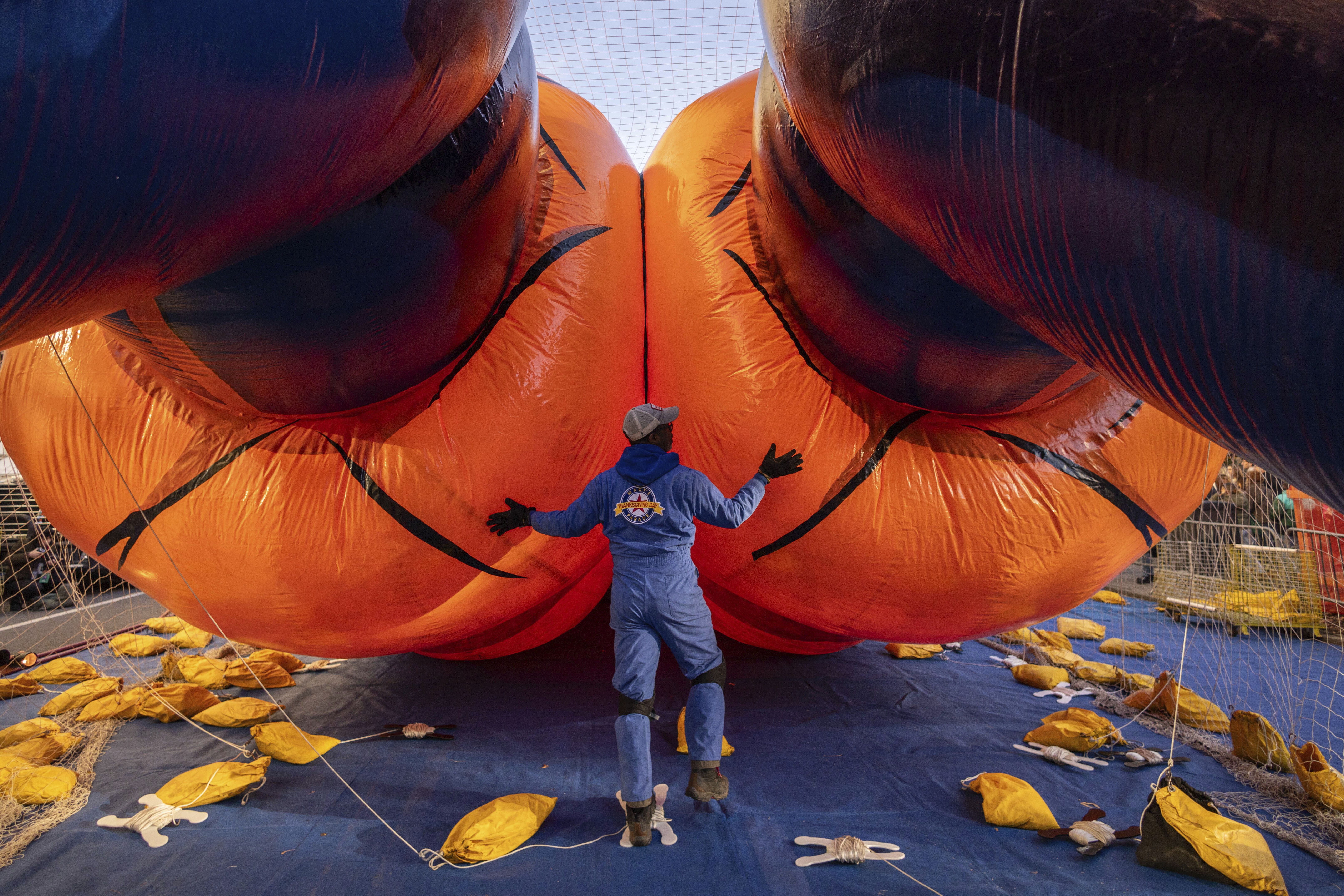 A person inflates a float of Goku from Dragon Ball Z yesterday for the Macy's Thanksgiving Day Parade.